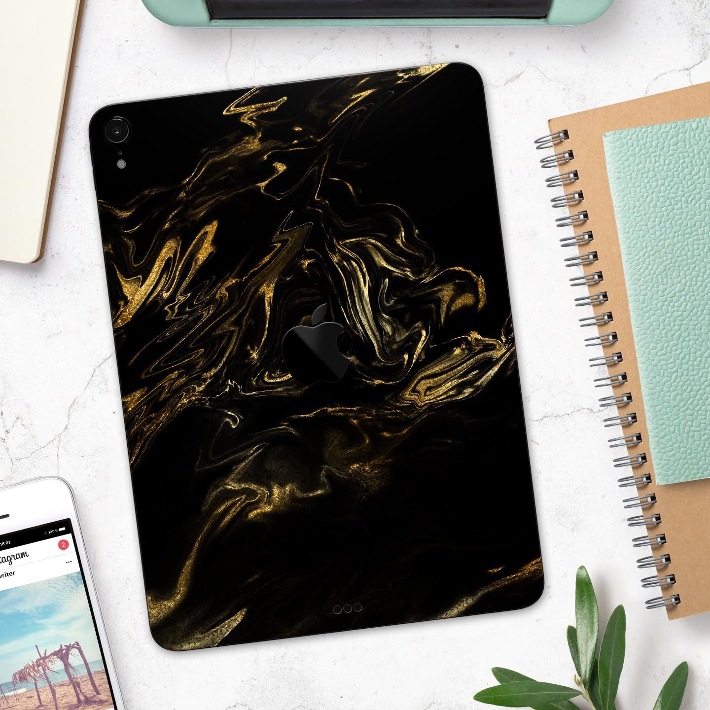 Black and gold marble swirl skin decal for Apple iPad, showcasing a stylish design with premium finish.
