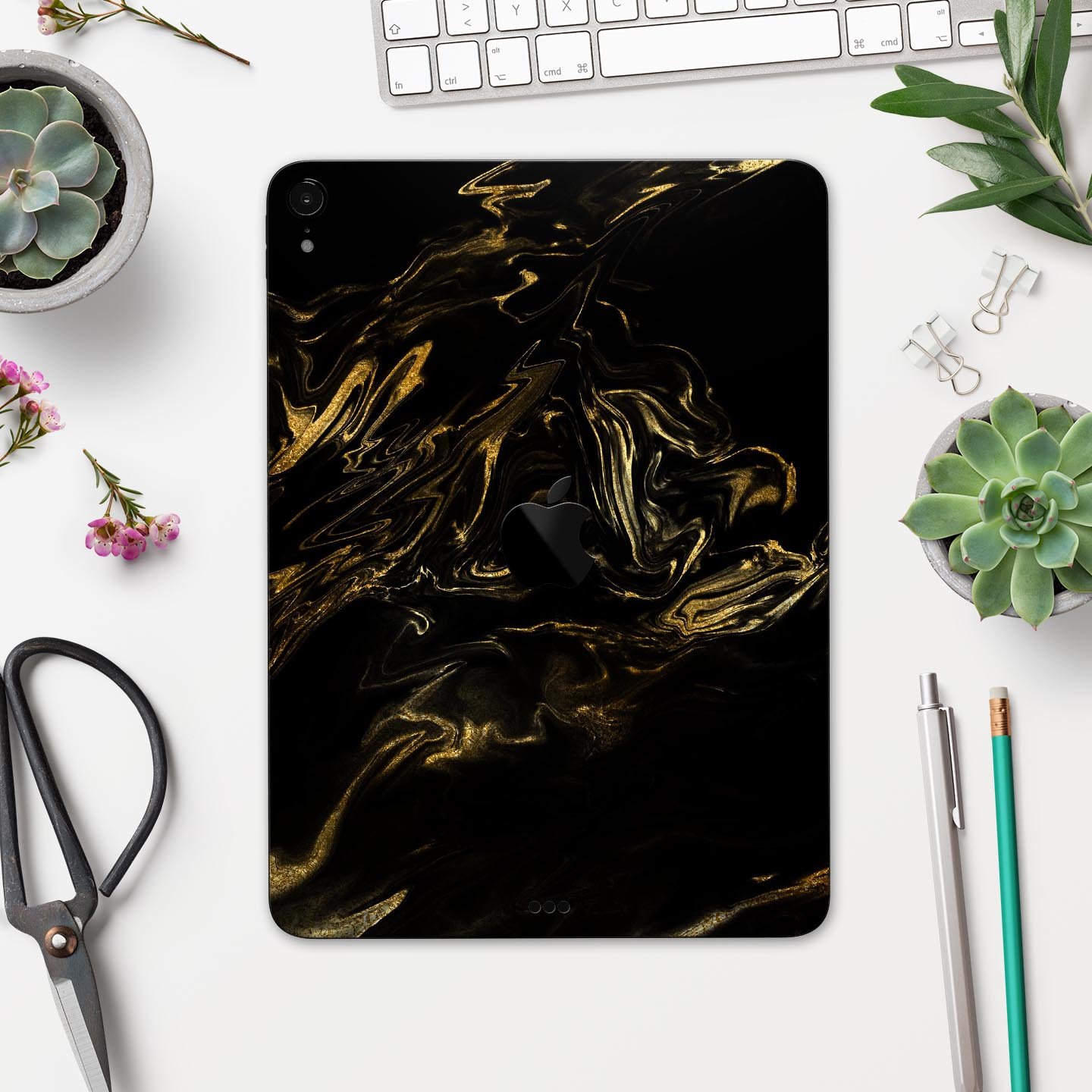 Black and gold marble swirl skin decal for Apple iPad, showcasing a stylish design with premium finish.
