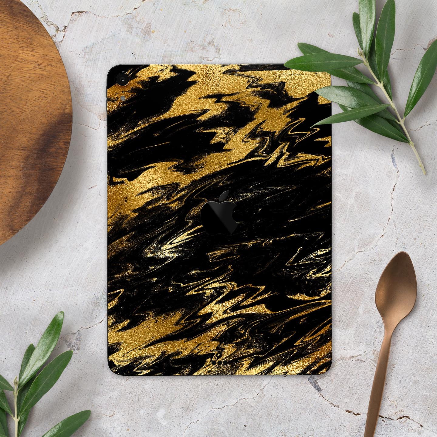 Black and gold marble swirl skin decal for Apple iPad, showcasing elegant design and premium finish.