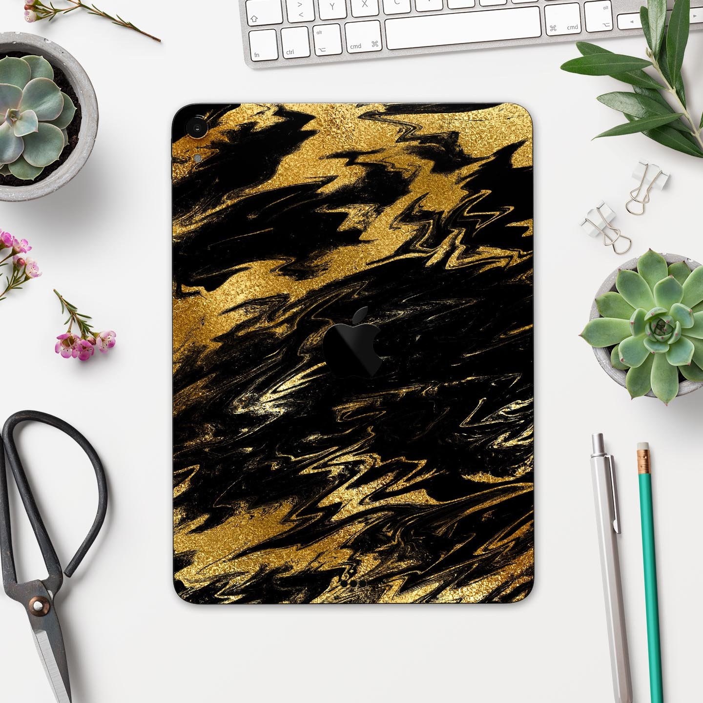 Black and gold marble swirl skin decal for Apple iPad, showcasing elegant design and premium finish.
