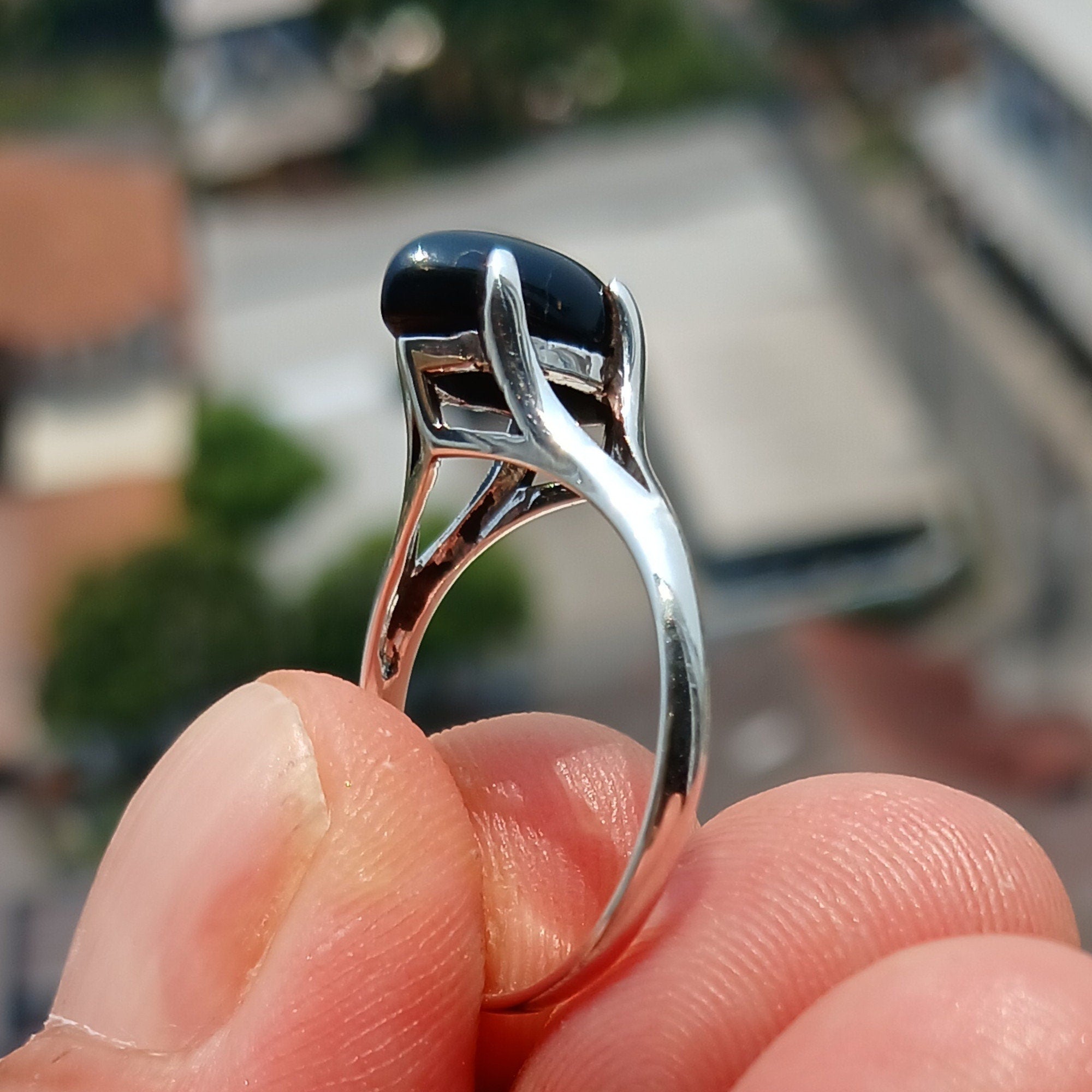 A beautiful Black Onyx Ring featuring a marquise shaped gemstone set in polished sterling silver, showcasing elegance and minimalist design.