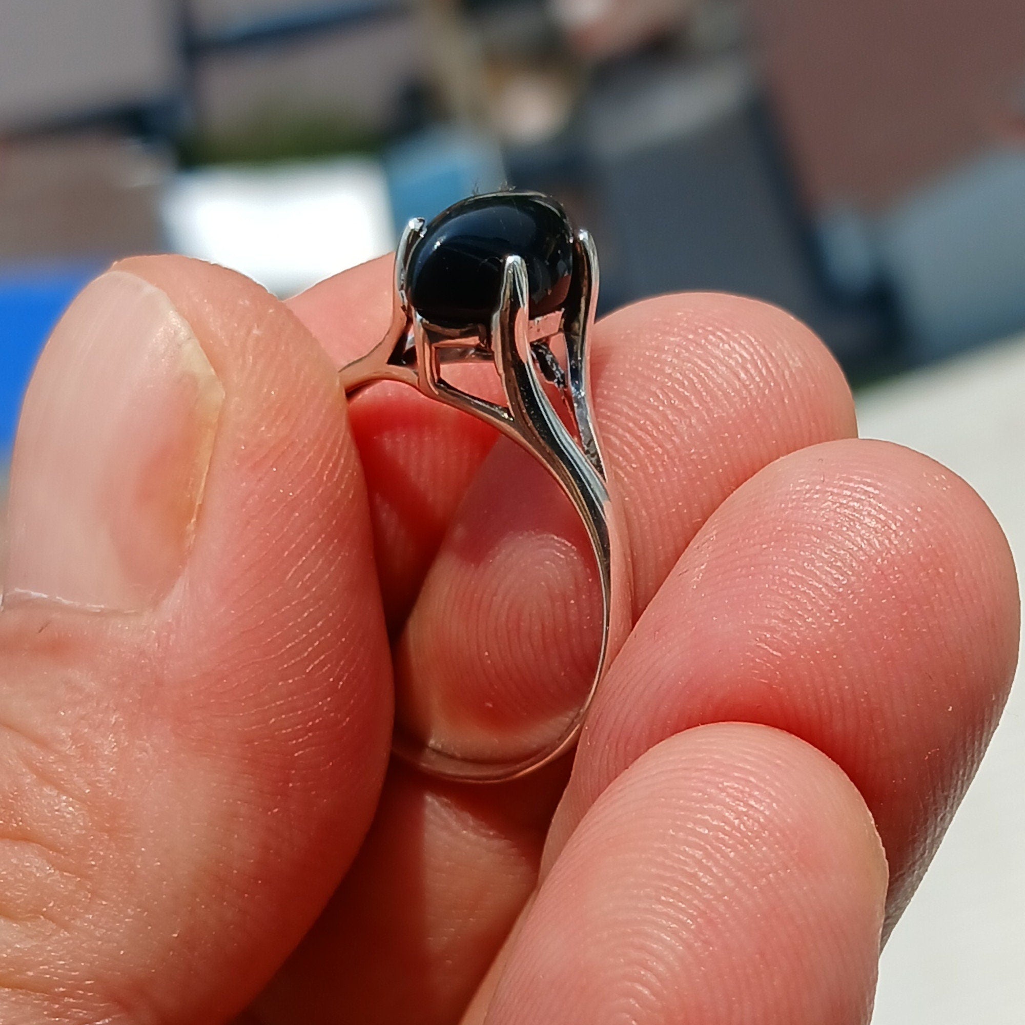 A beautiful Black Onyx Ring featuring a marquise shaped gemstone set in polished sterling silver, showcasing elegance and minimalist design.