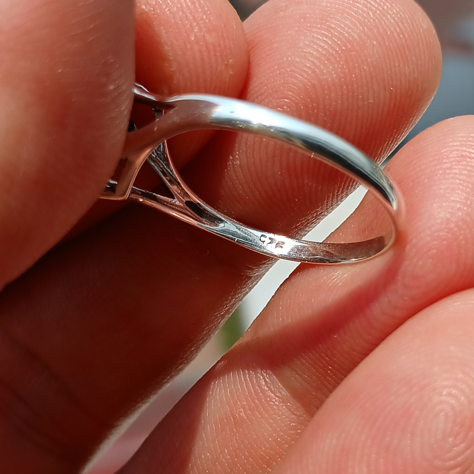 A beautiful Black Onyx Ring featuring a marquise shaped gemstone set in polished sterling silver, showcasing elegance and minimalist design.