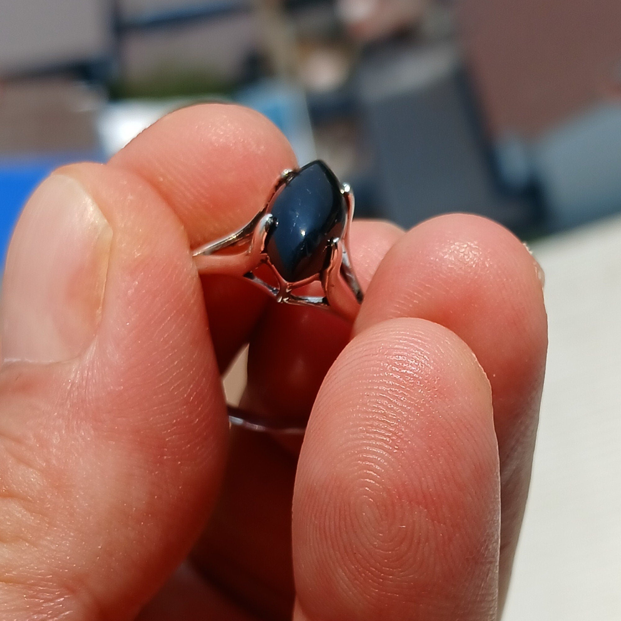 A beautiful Black Onyx Ring featuring a marquise shaped gemstone set in polished sterling silver, showcasing elegance and minimalist design.