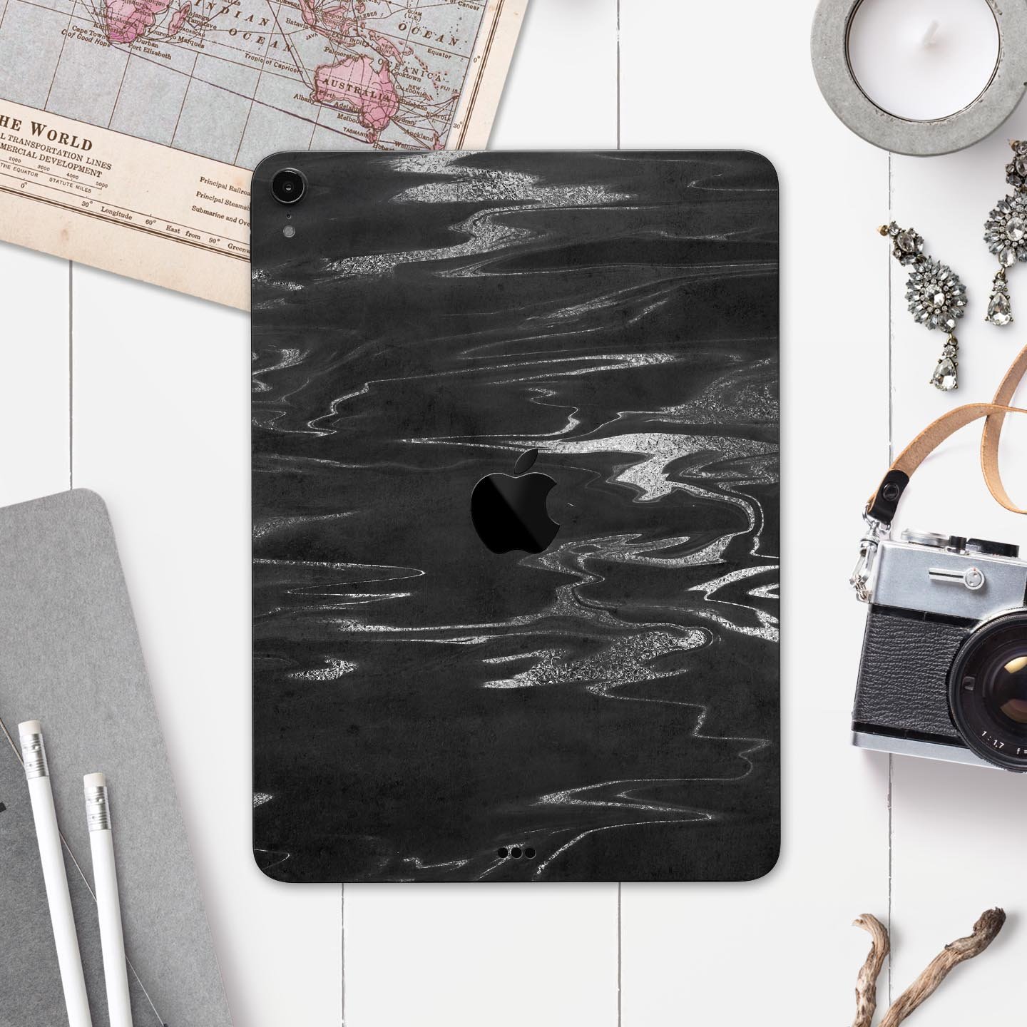 Black and silver marble swirl skin decal for Apple devices, showcasing a stylish design with premium finish.