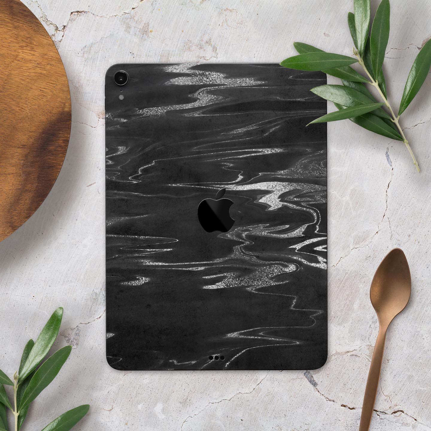 Black and silver marble swirl skin decal for Apple devices, showcasing a stylish design with premium finish.