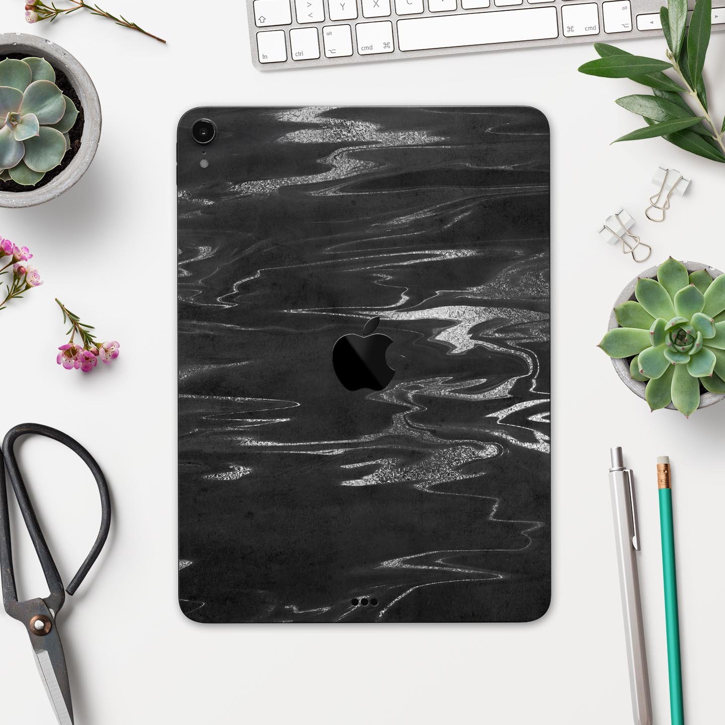 Black and silver marble swirl skin decal for Apple devices, showcasing a stylish design with premium finish.