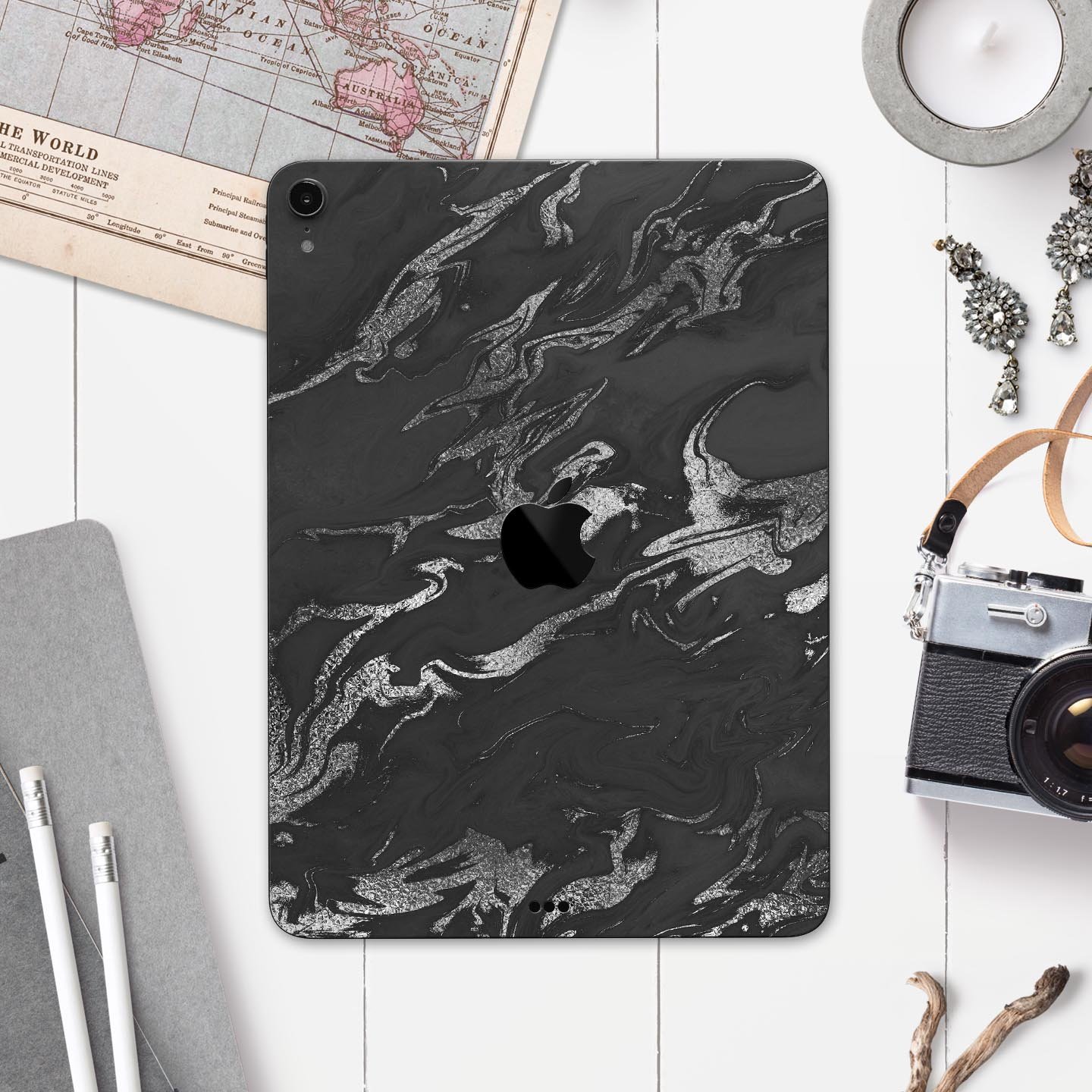 Black and silver marble swirl skin decal for Apple devices, showcasing a stylish design with ultra-thin protection.