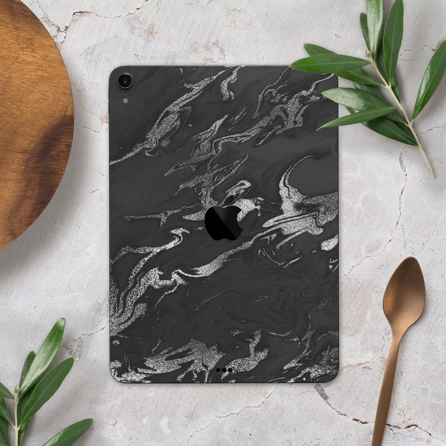 Black and silver marble swirl skin decal for Apple devices, showcasing a stylish design with ultra-thin protection.