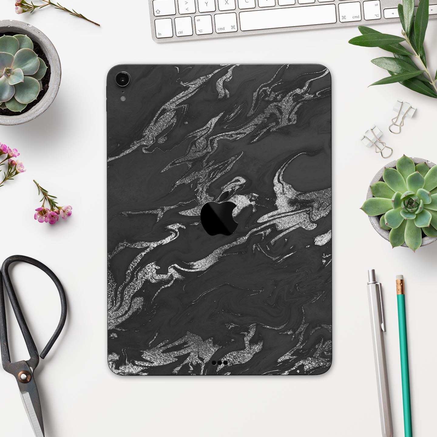 Black and silver marble swirl skin decal for Apple devices, showcasing a stylish design with ultra-thin protection.