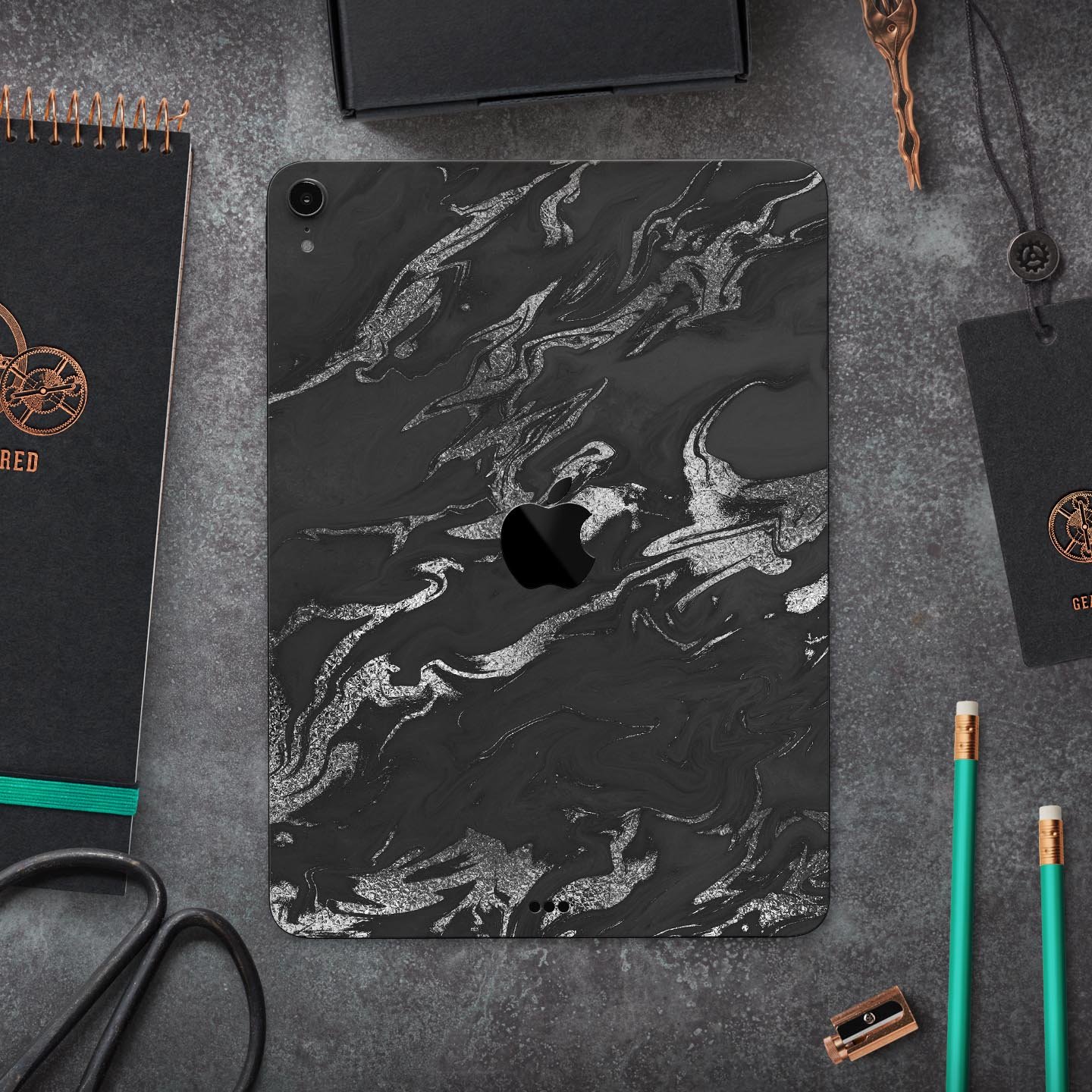 Black and silver marble swirl skin decal for Apple devices, showcasing a stylish design with ultra-thin protection.