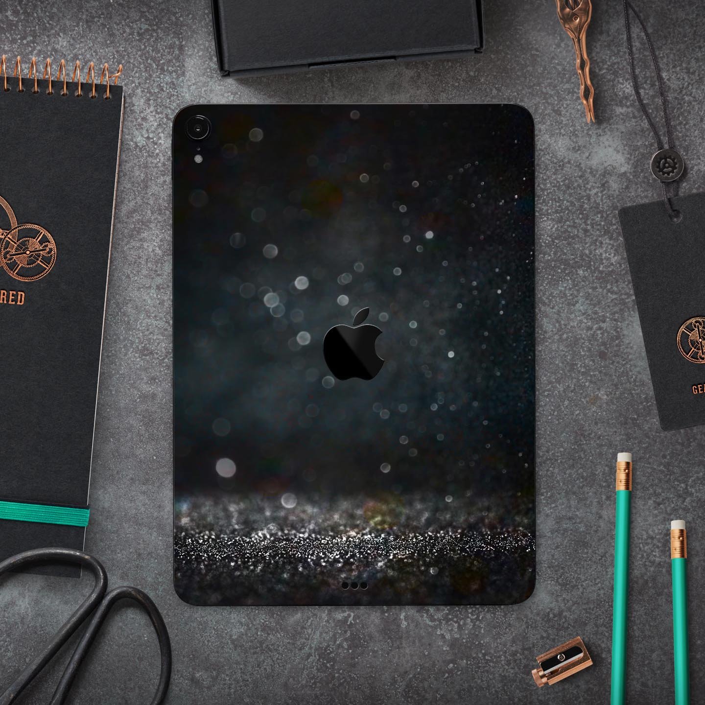 Black Unfocused Glowing Shimmer skin decal for Apple devices, showcasing its sleek design and premium finish.