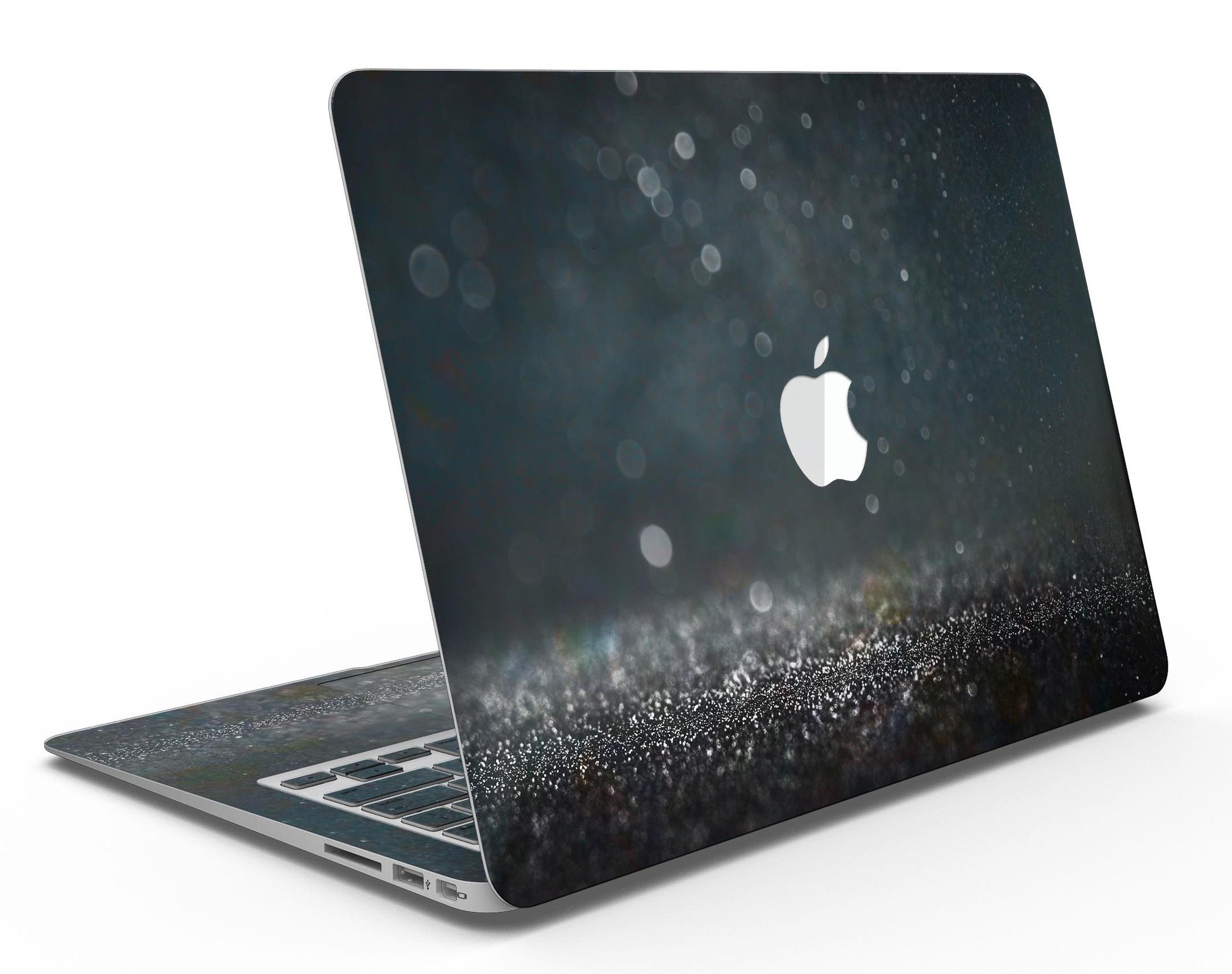 Black Unfocused Glowing Shimmer skin applied to a MacBook Air, showcasing its sleek design and vibrant shimmer effect.