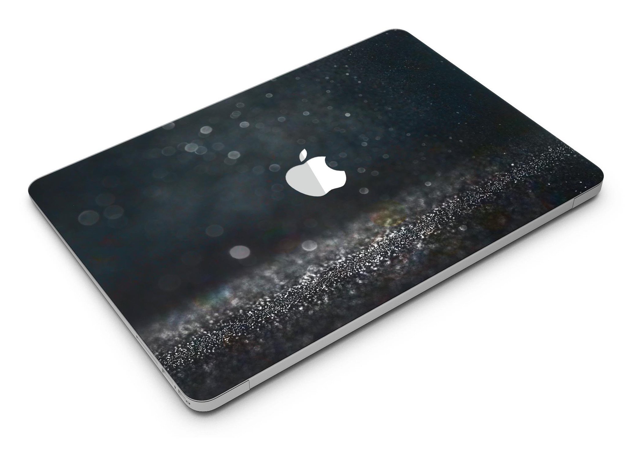 Black Unfocused Glowing Shimmer skin applied to a MacBook Air, showcasing its sleek design and vibrant shimmer effect.