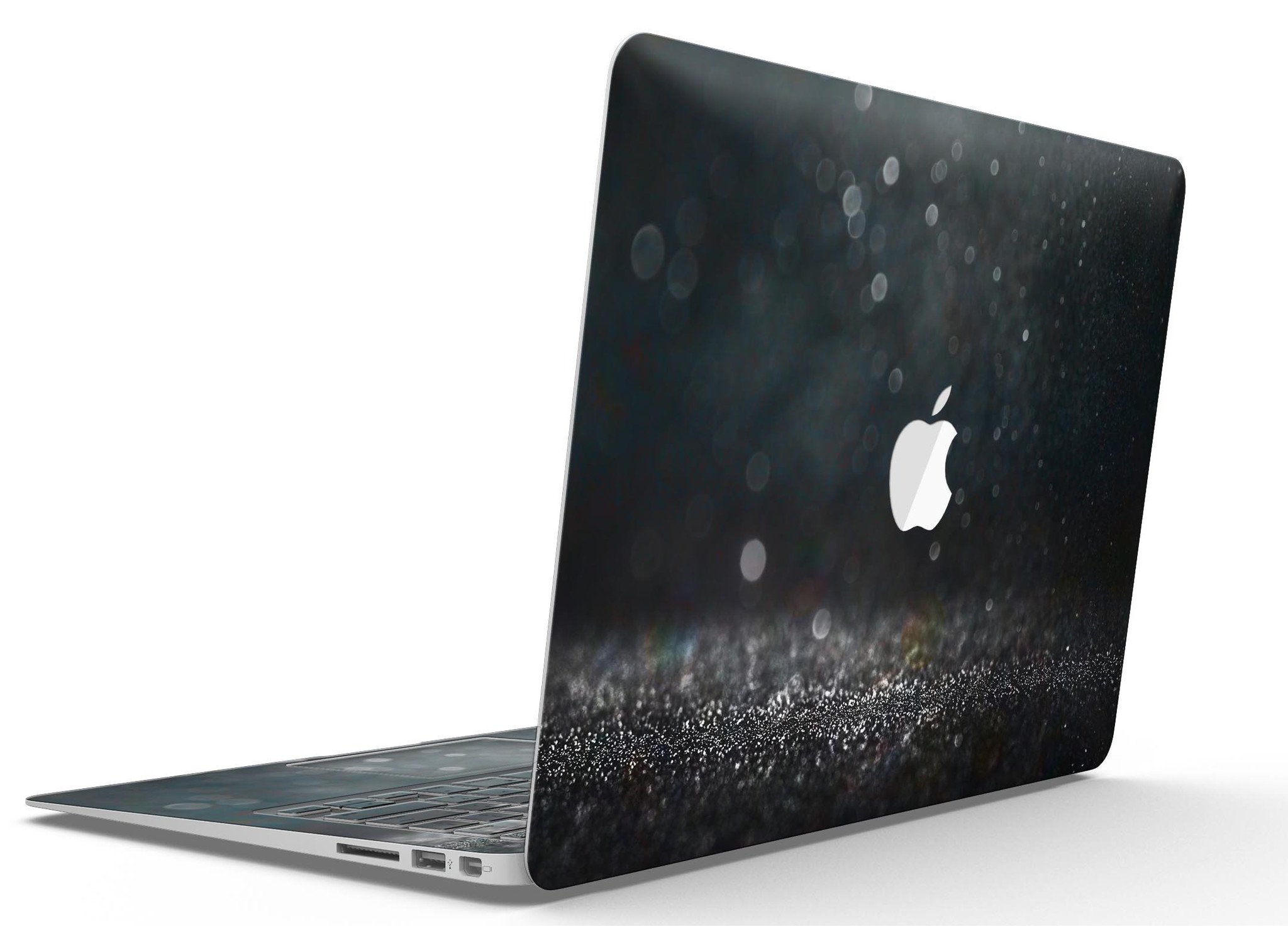 Black Unfocused Glowing Shimmer skin applied to a MacBook Air, showcasing its sleek design and vibrant shimmer effect.