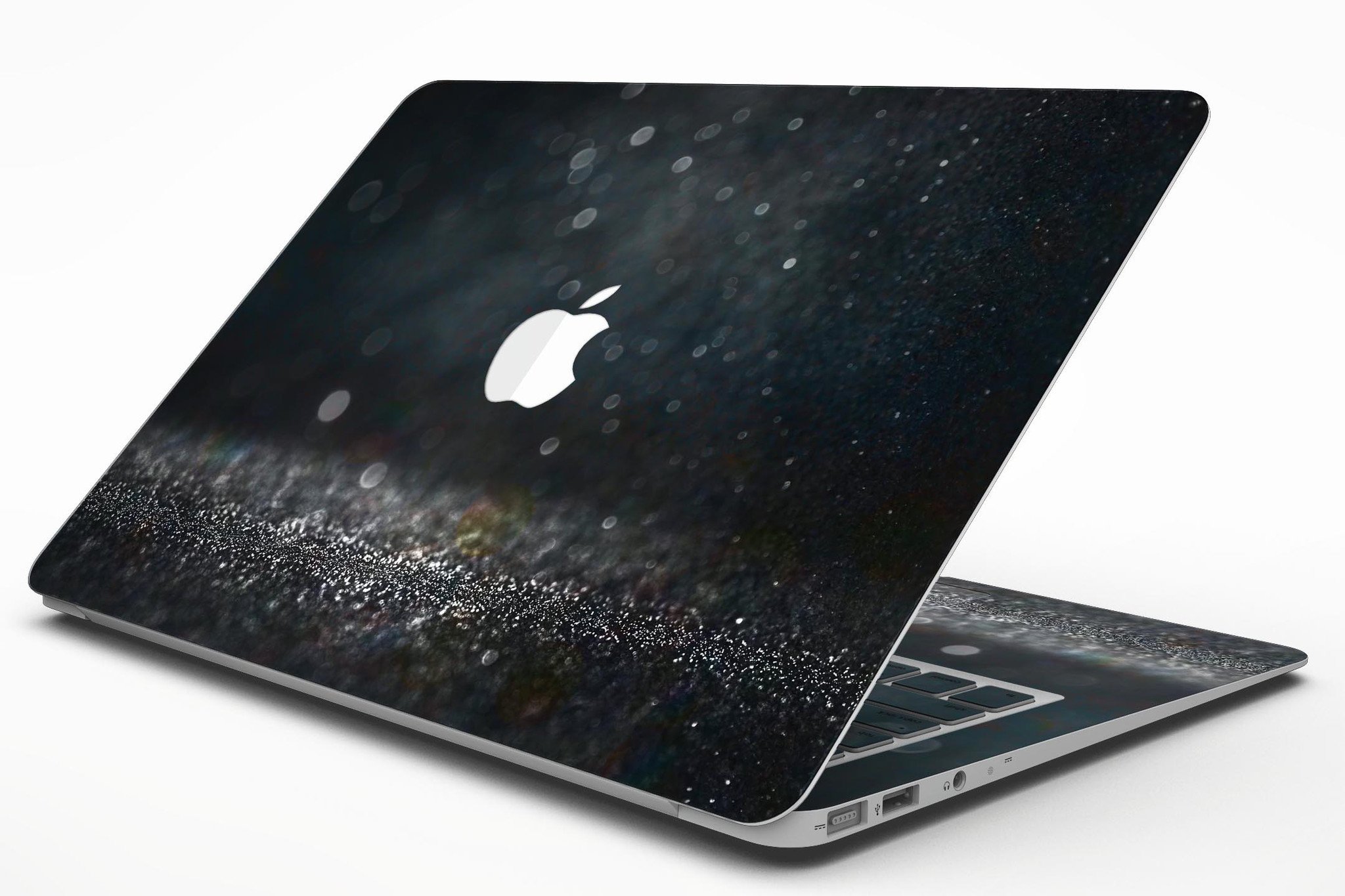 Black Unfocused Glowing Shimmer skin applied to a MacBook Air, showcasing its sleek design and vibrant shimmer effect.