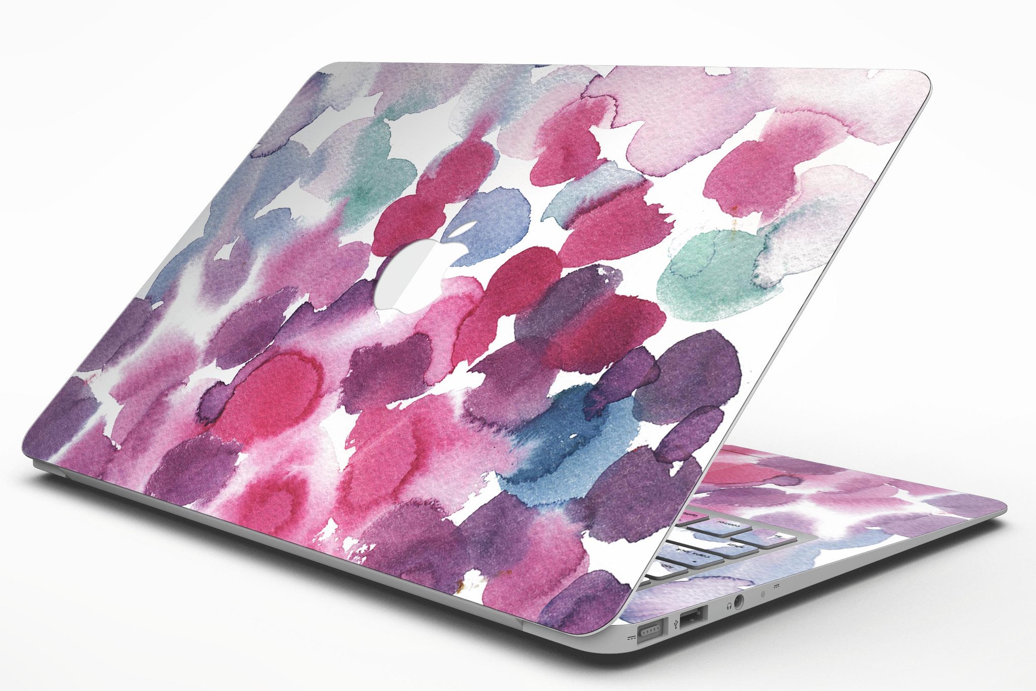 Blot 4 Absorbed Watercolor Texture skin applied to a MacBook Air, showcasing vibrant colors and a sleek design.