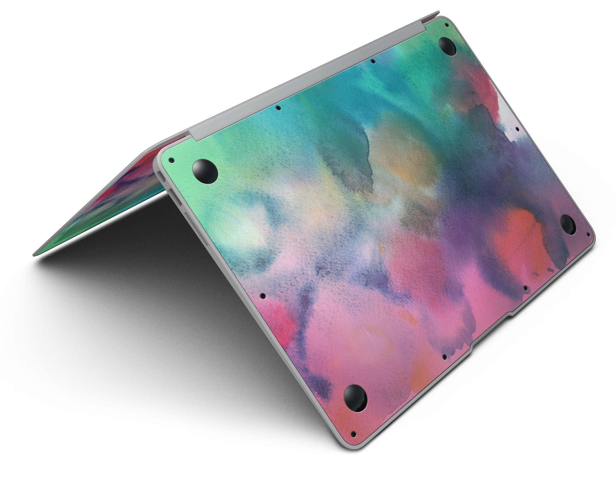 Blotted 534 Absorbed Watercolor Texture skin applied to a MacBook Air, showcasing vibrant colors and a sleek design.