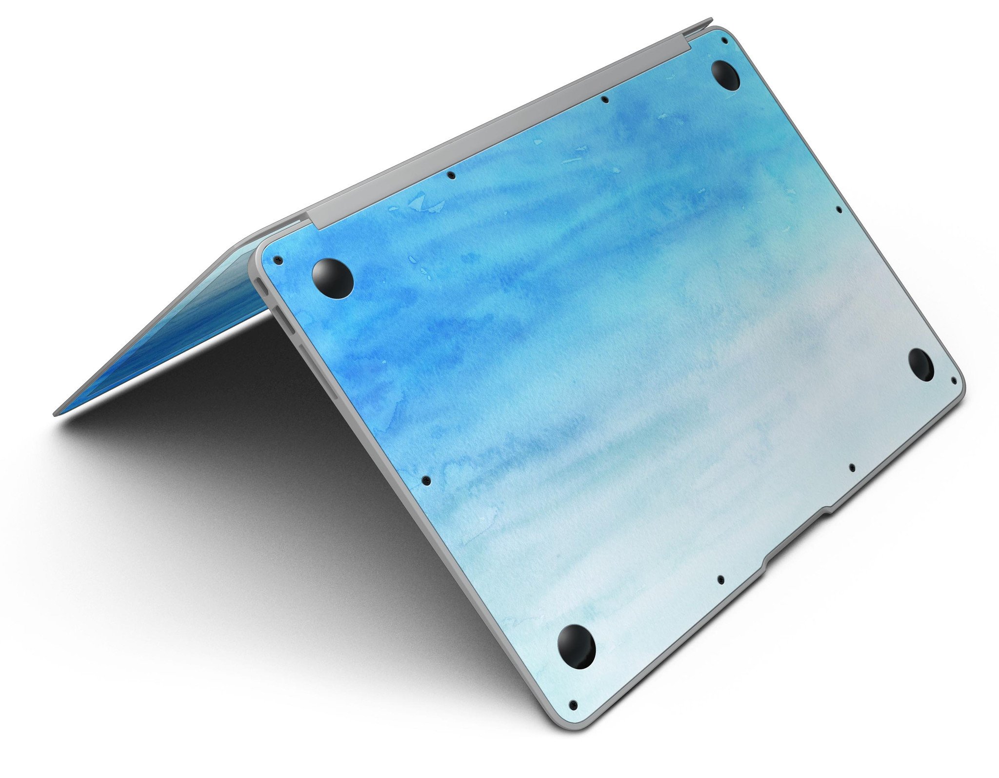 Blotted Blues Absorbed Watercolor Texture MacBook Air Skin Kit showcasing vibrant watercolor design on a sleek MacBook Air.