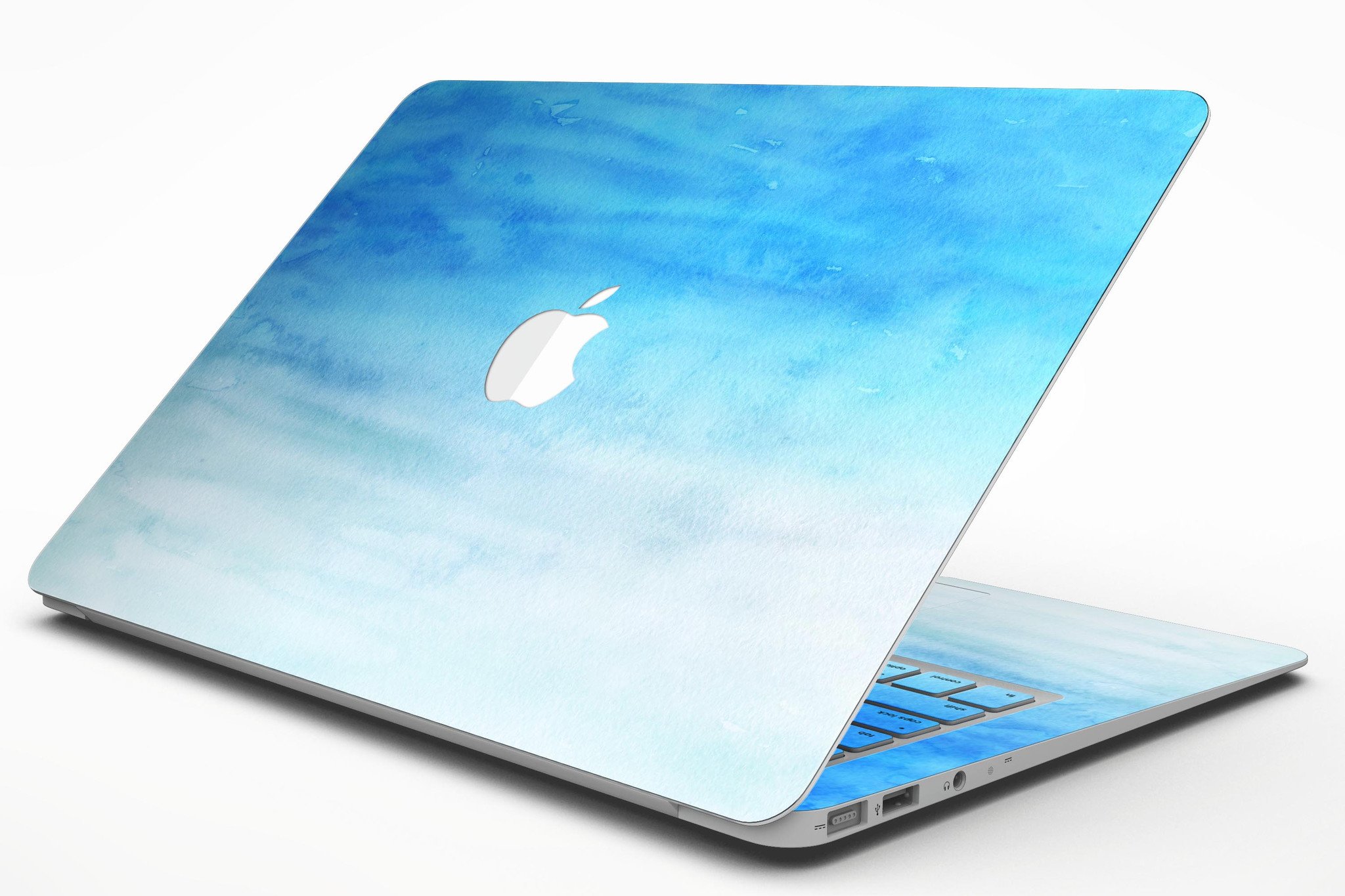 Blotted Blues Absorbed Watercolor Texture MacBook Air Skin Kit showcasing vibrant watercolor design on a sleek MacBook Air.