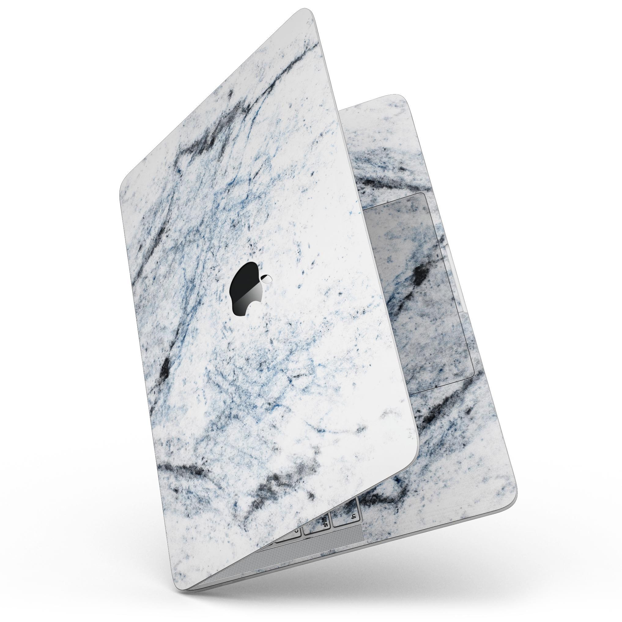 Blue and Black Grunge skin for 13" MacBook Pro on a white marble surface, showcasing its stylish design and premium quality.