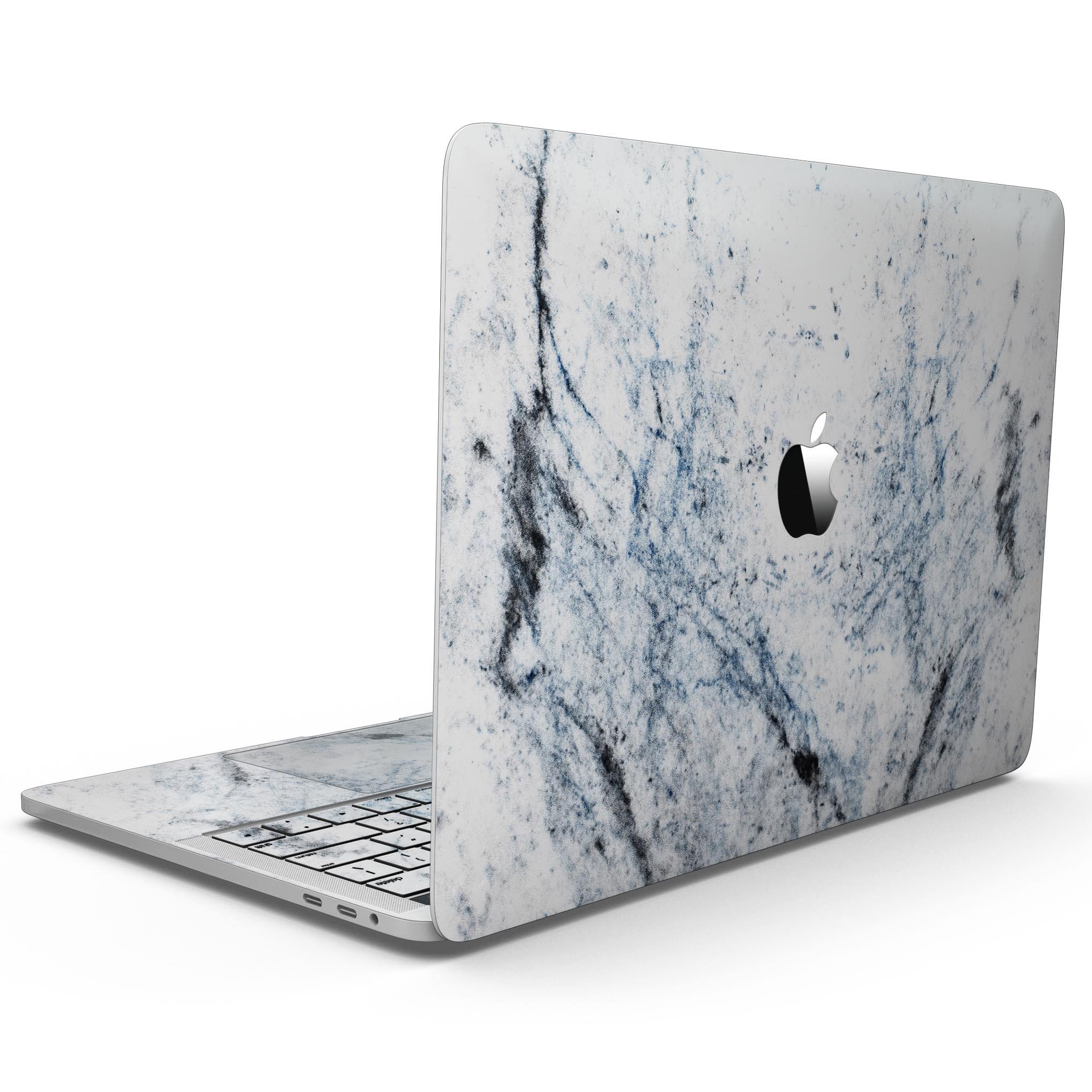 Blue and Black Grunge skin for 13" MacBook Pro on a white marble surface, showcasing its stylish design and premium quality.