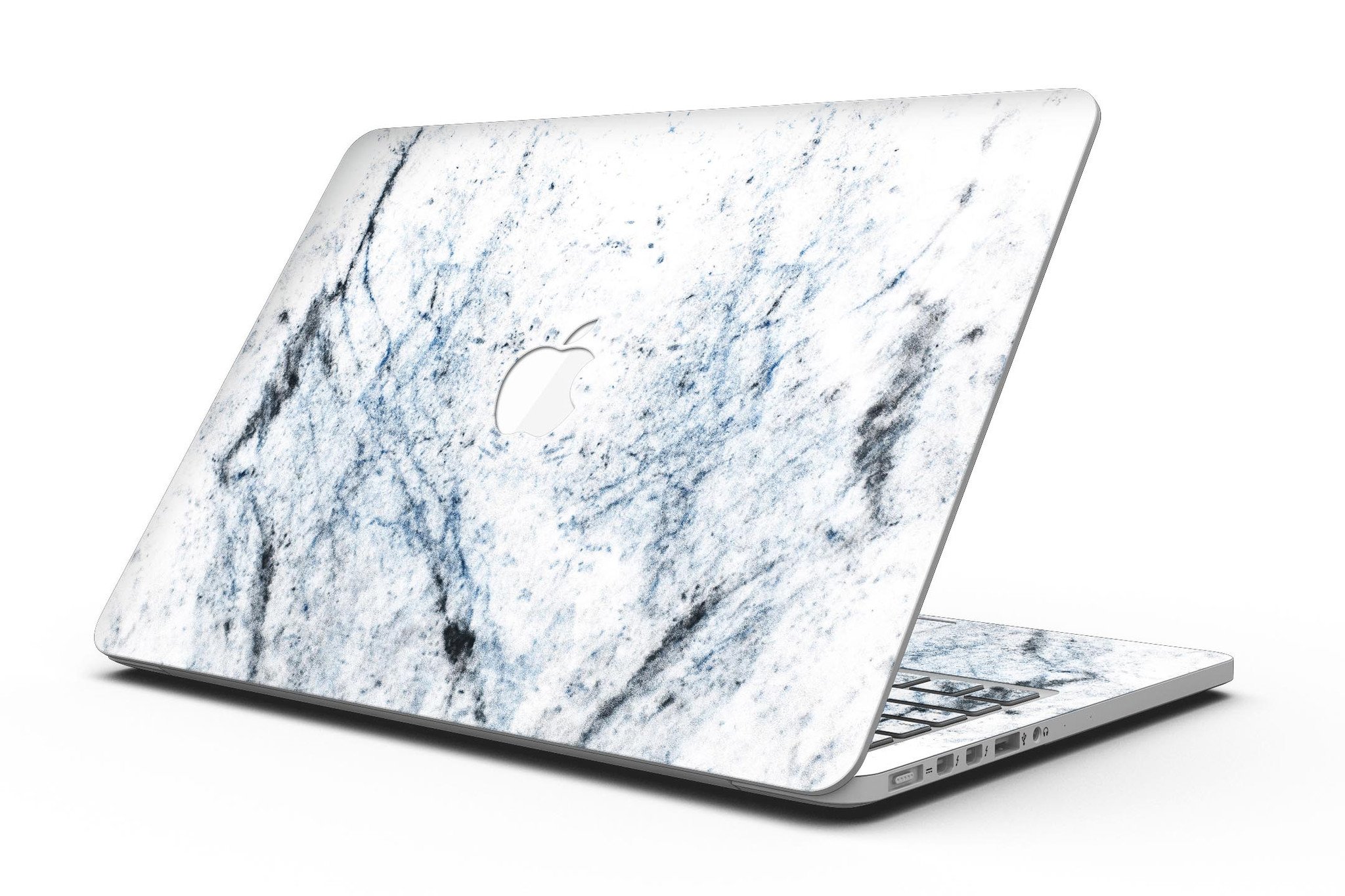 Blue and black grunge vinyl skin on a MacBook Pro with Retina Display, showcasing a stylish design over a white marble surface.