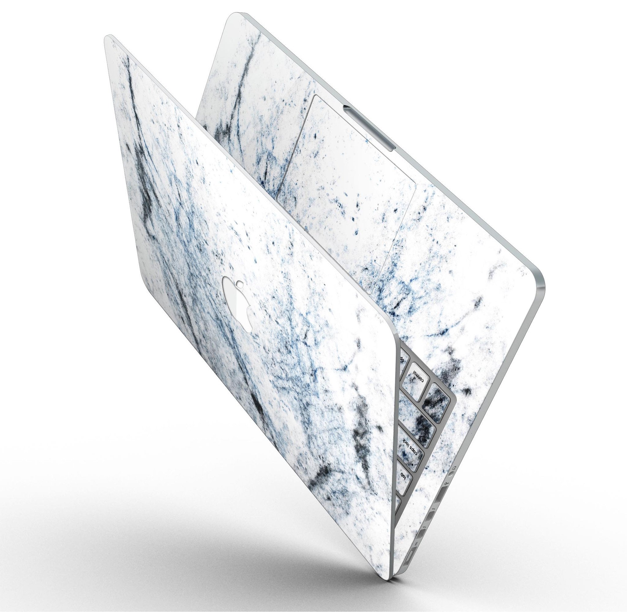 Blue and black grunge vinyl skin on a MacBook Pro with Retina Display, showcasing a stylish design over a white marble surface.