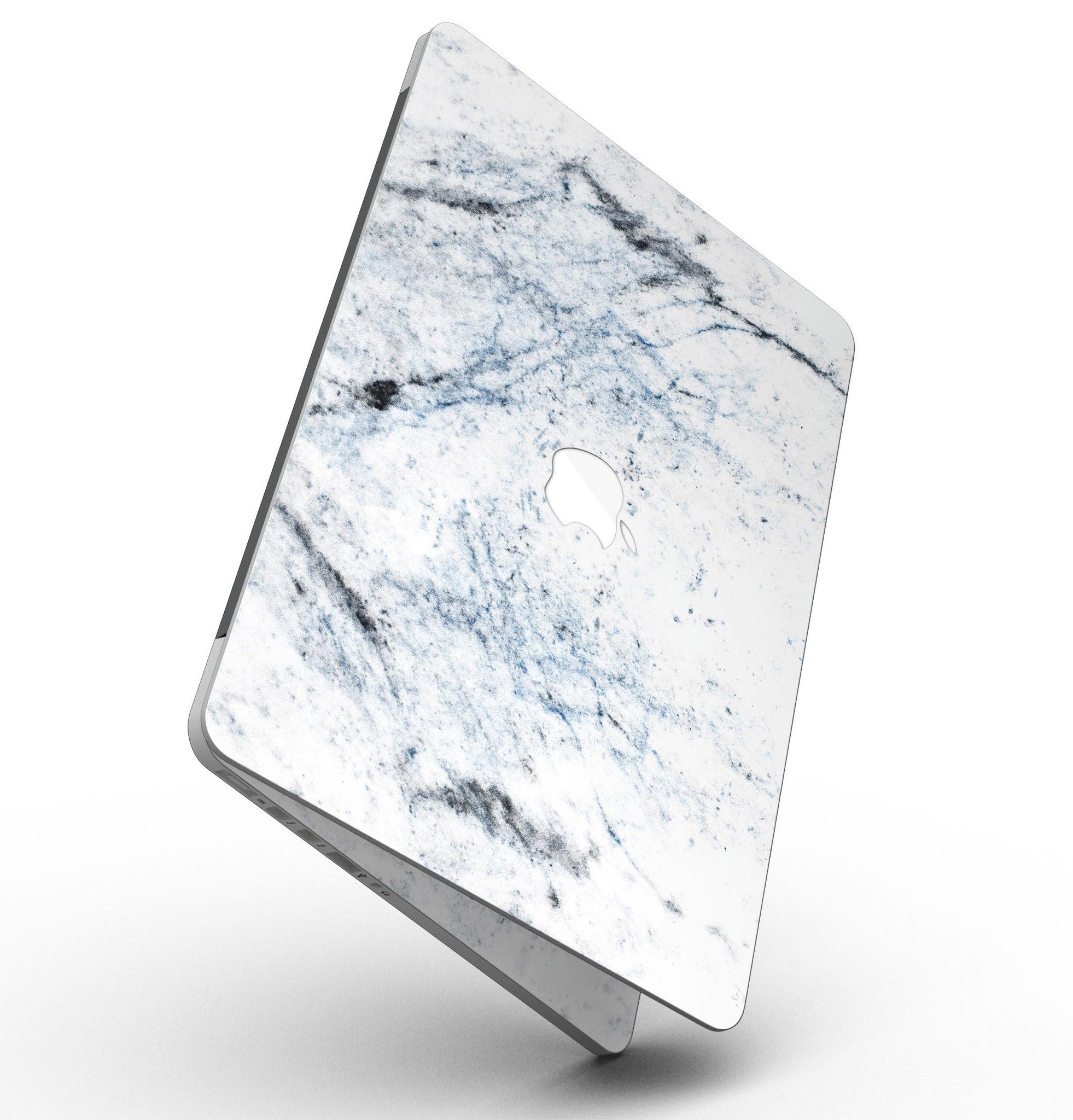 Blue and black grunge vinyl skin on a MacBook Pro with Retina Display, showcasing a stylish design over a white marble surface.