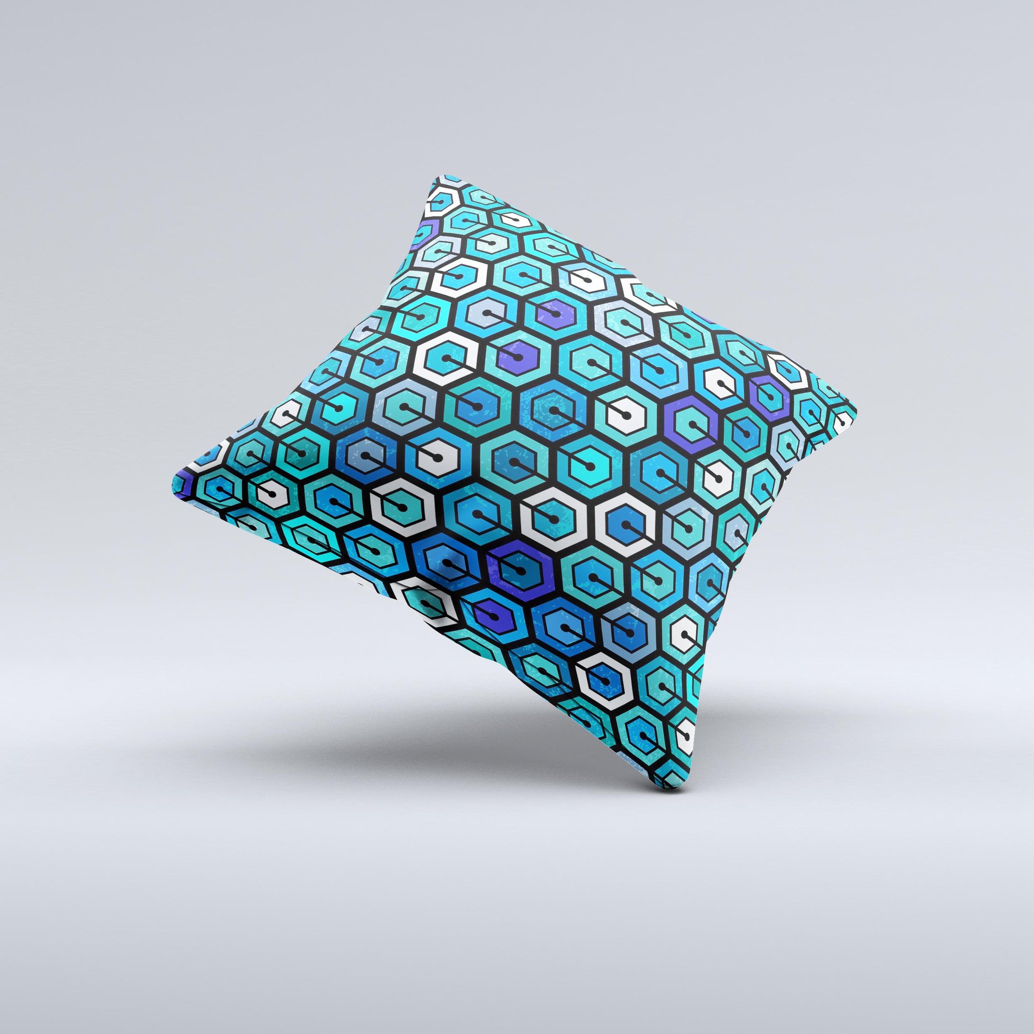 A vibrant decorative throw pillow featuring a unique hexagon pattern in blue and green colors, handcrafted in Virginia.