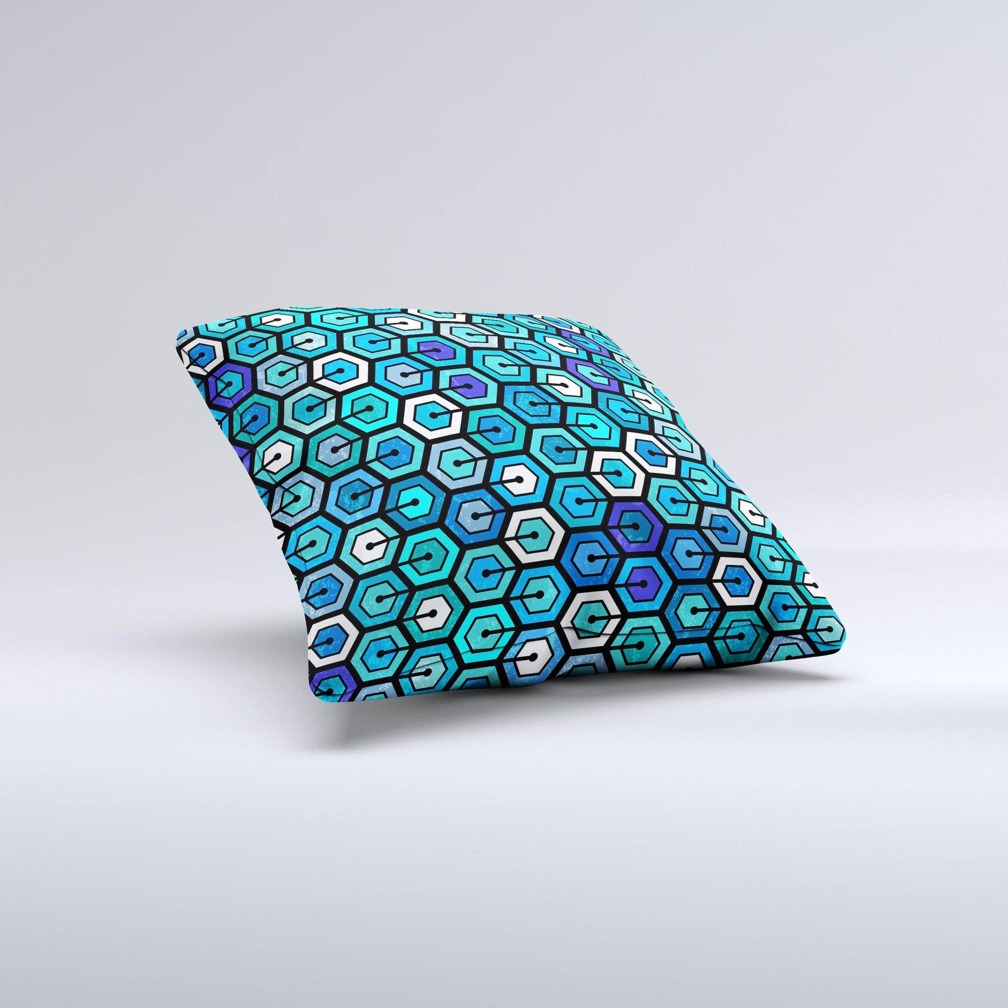 A vibrant decorative throw pillow featuring a unique hexagon pattern in blue and green colors, handcrafted in Virginia.