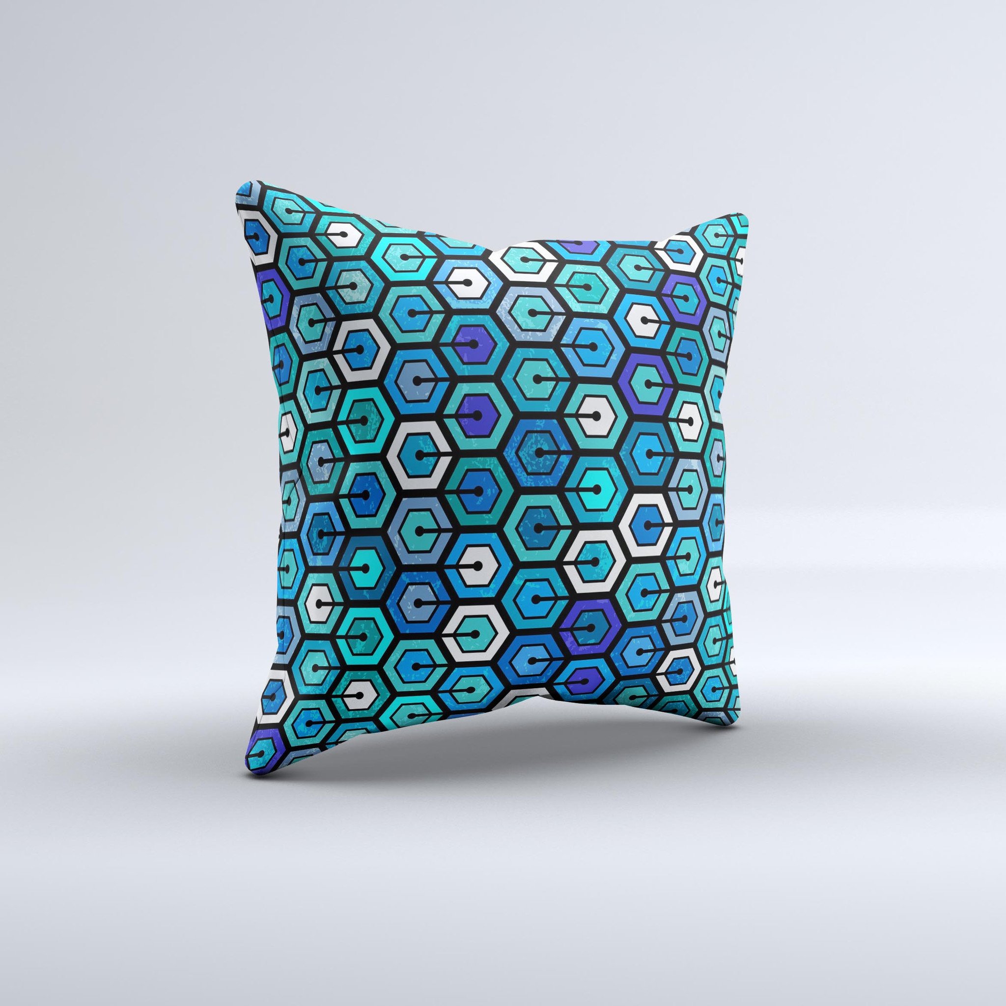 A vibrant decorative throw pillow featuring a unique hexagon pattern in blue and green colors, handcrafted in Virginia.