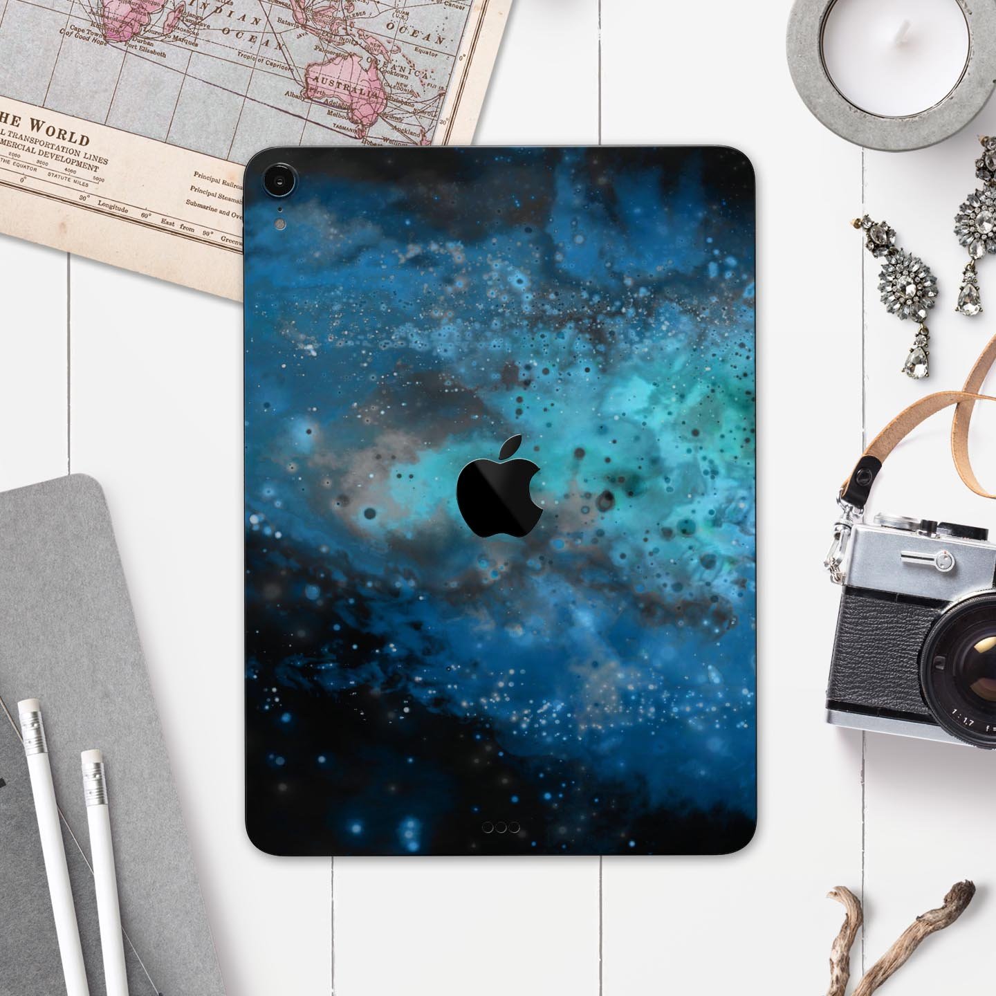 Blue and teal painted universe skin decal for Apple devices, showcasing vibrant colors and intricate design for full body protection.
