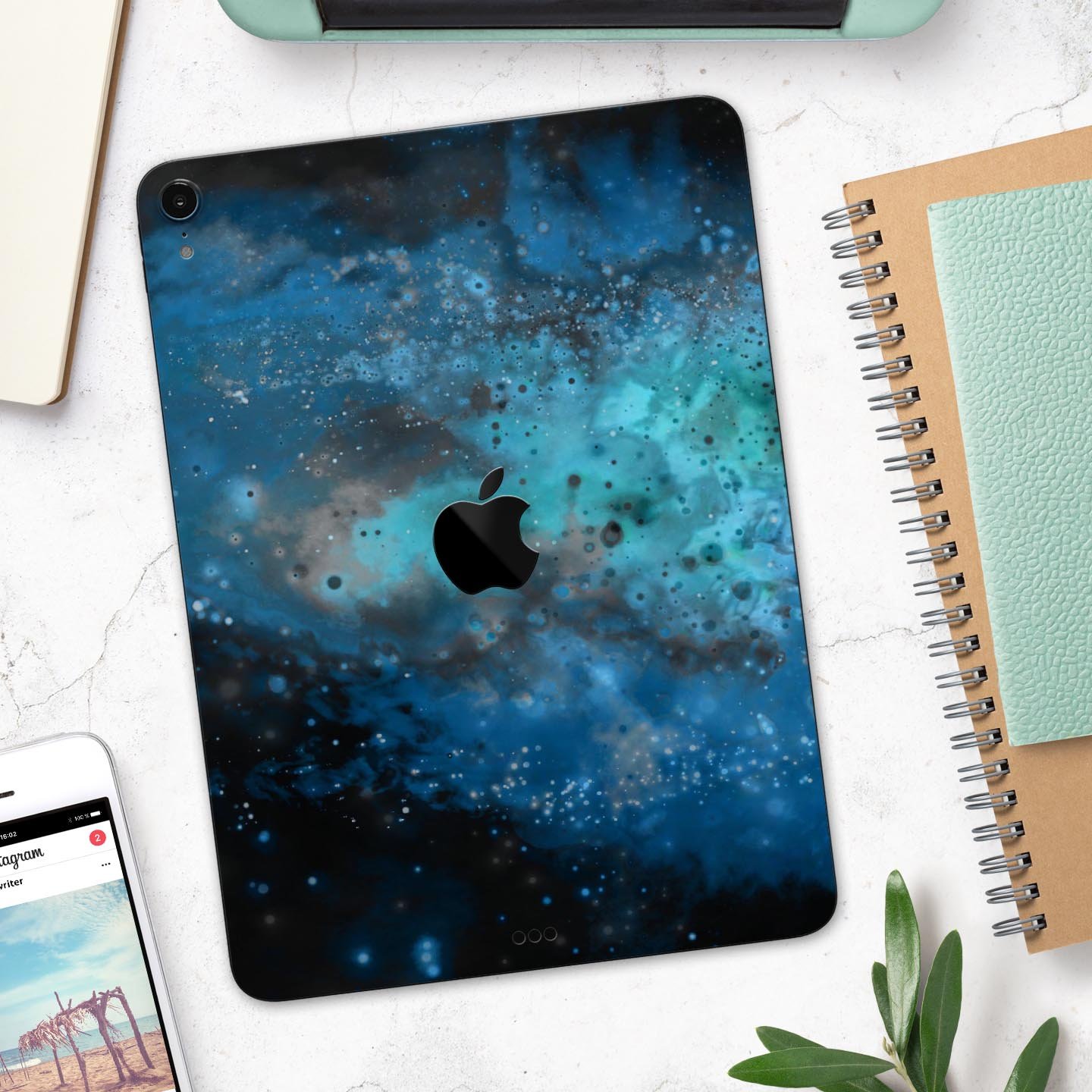 Blue and teal painted universe skin decal for Apple devices, showcasing vibrant colors and intricate design for full body protection.