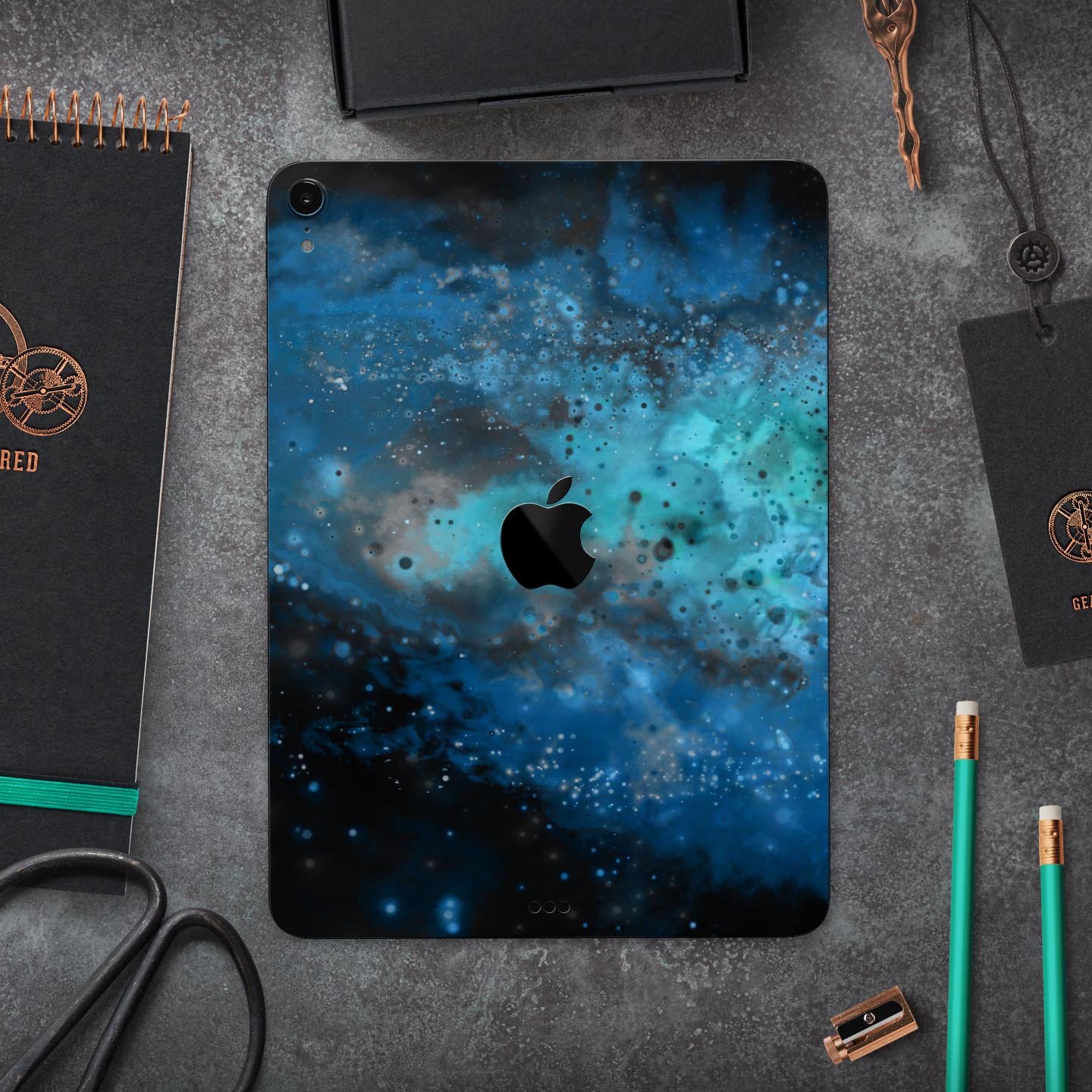 Blue and teal painted universe skin decal for Apple devices, showcasing vibrant colors and intricate design for full body protection.