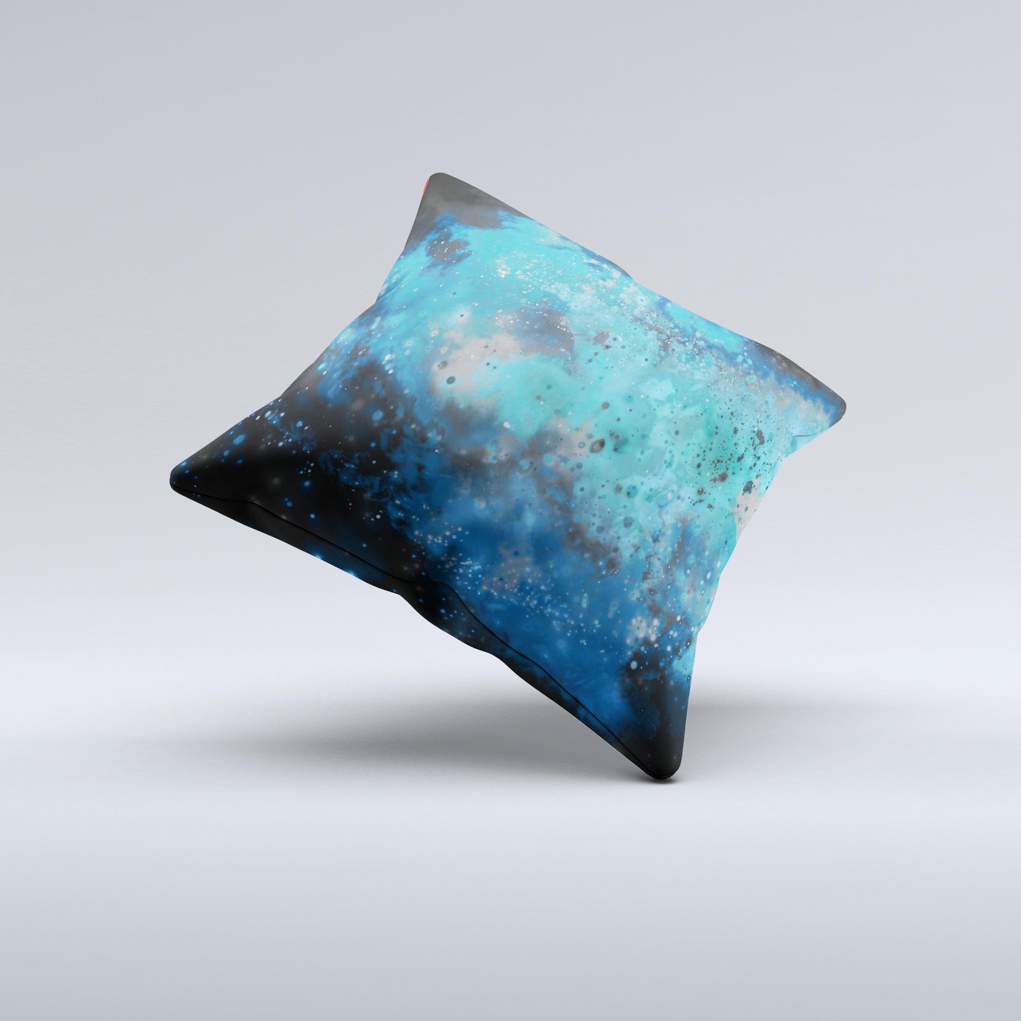 A vibrant blue and teal decorative throw pillow featuring a unique ink-fuzed universe design, handcrafted in Virginia.