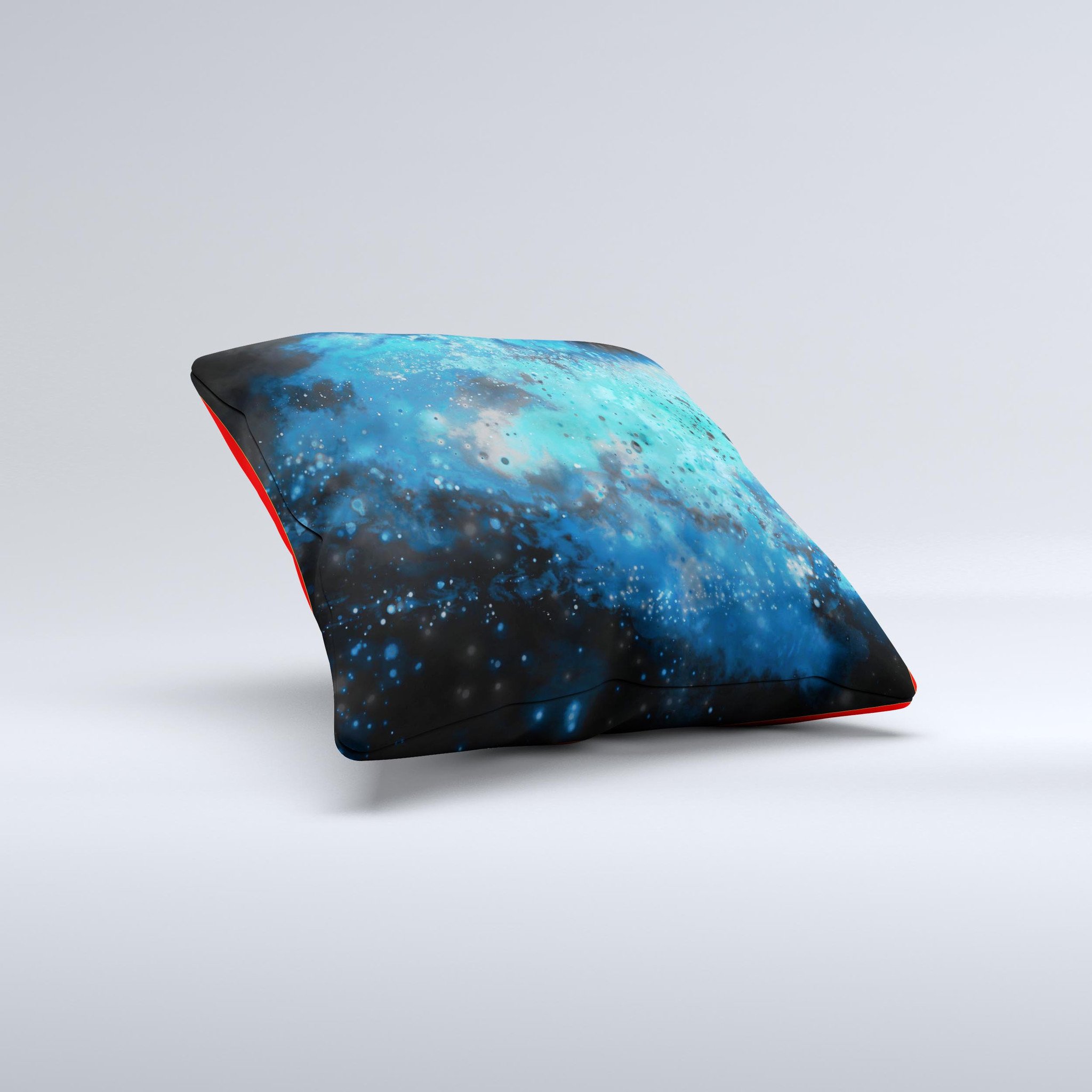 A vibrant blue and teal decorative throw pillow featuring a unique ink-fuzed universe design, handcrafted in Virginia.