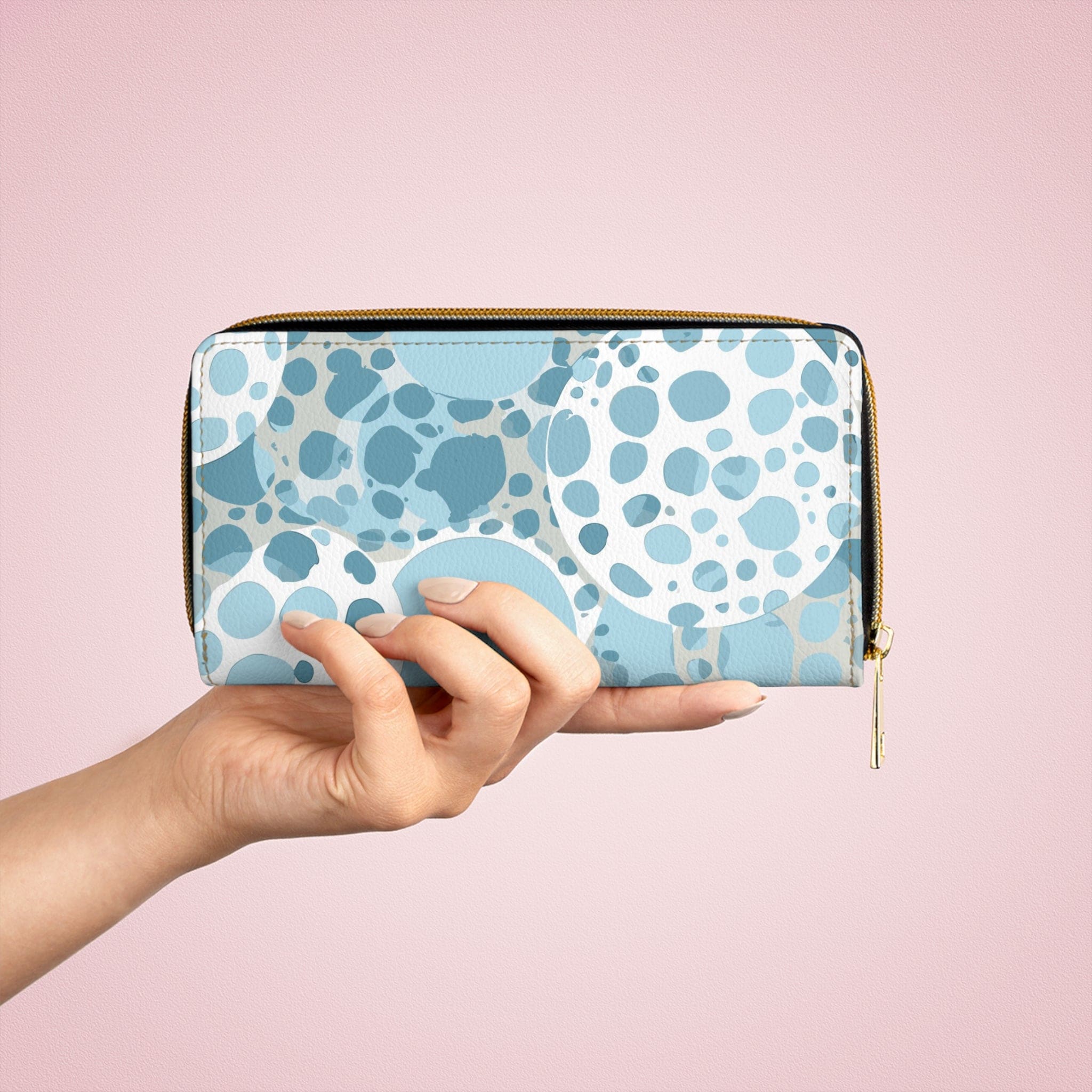 Blue and white women's zipper wallet featuring a circular spotted illustration, showcasing its stylish design and functional compartments.