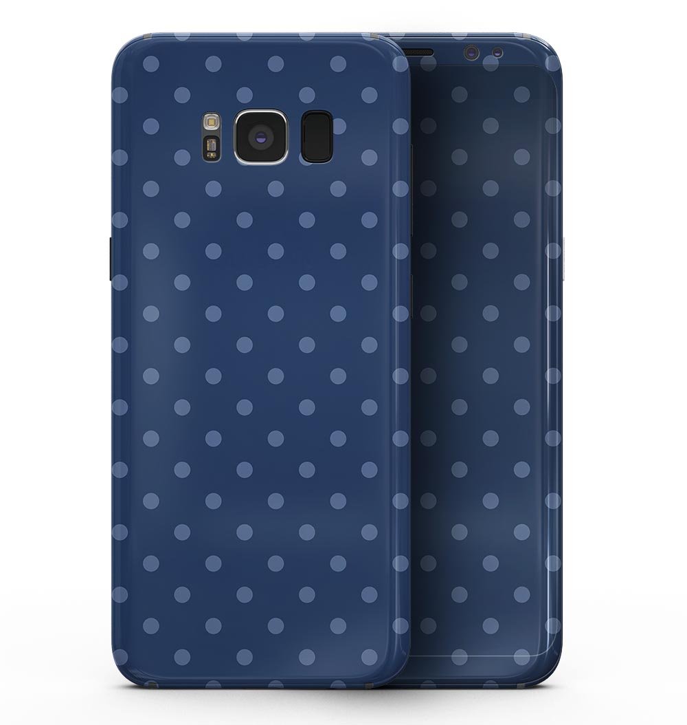 Samsung Galaxy S8 with a blue polka dot skin over a navy background, showcasing a stylish and protective design.