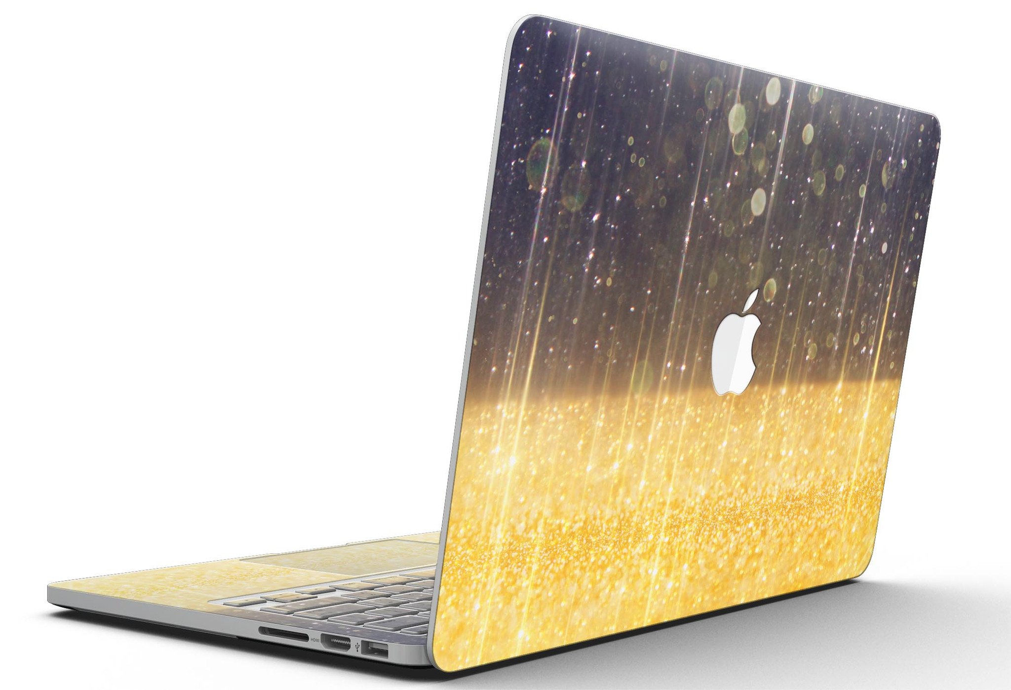 A MacBook Pro with a blue streaked skin featuring unfocused gold sparkles, showcasing a stylish and protective design.