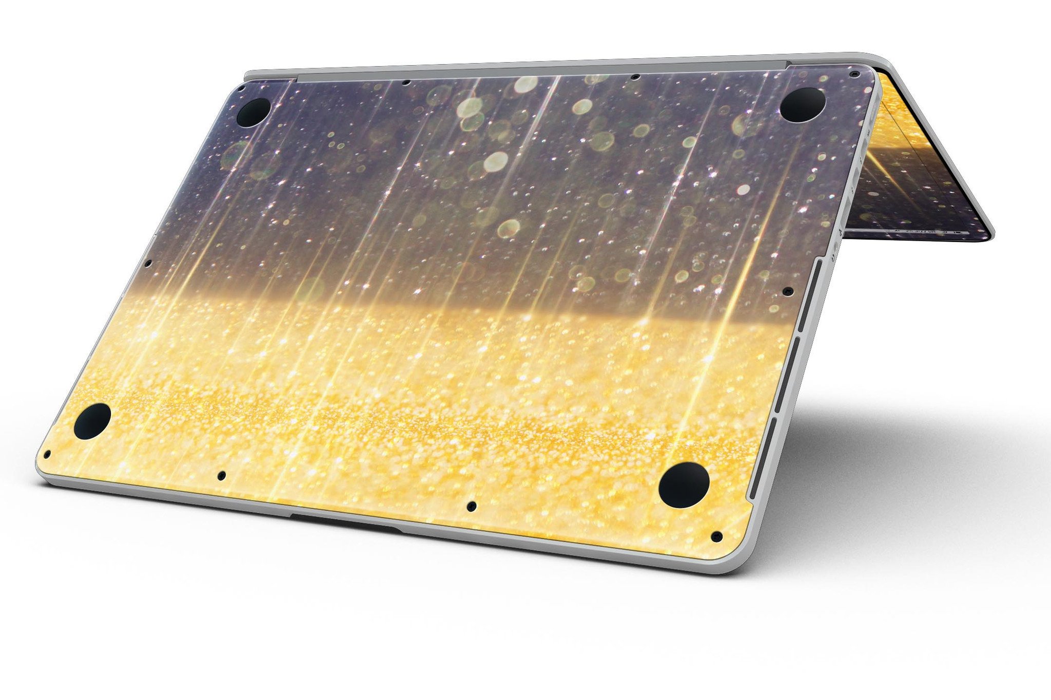 A MacBook Pro with a blue streaked skin featuring unfocused gold sparkles, showcasing a stylish and protective design.