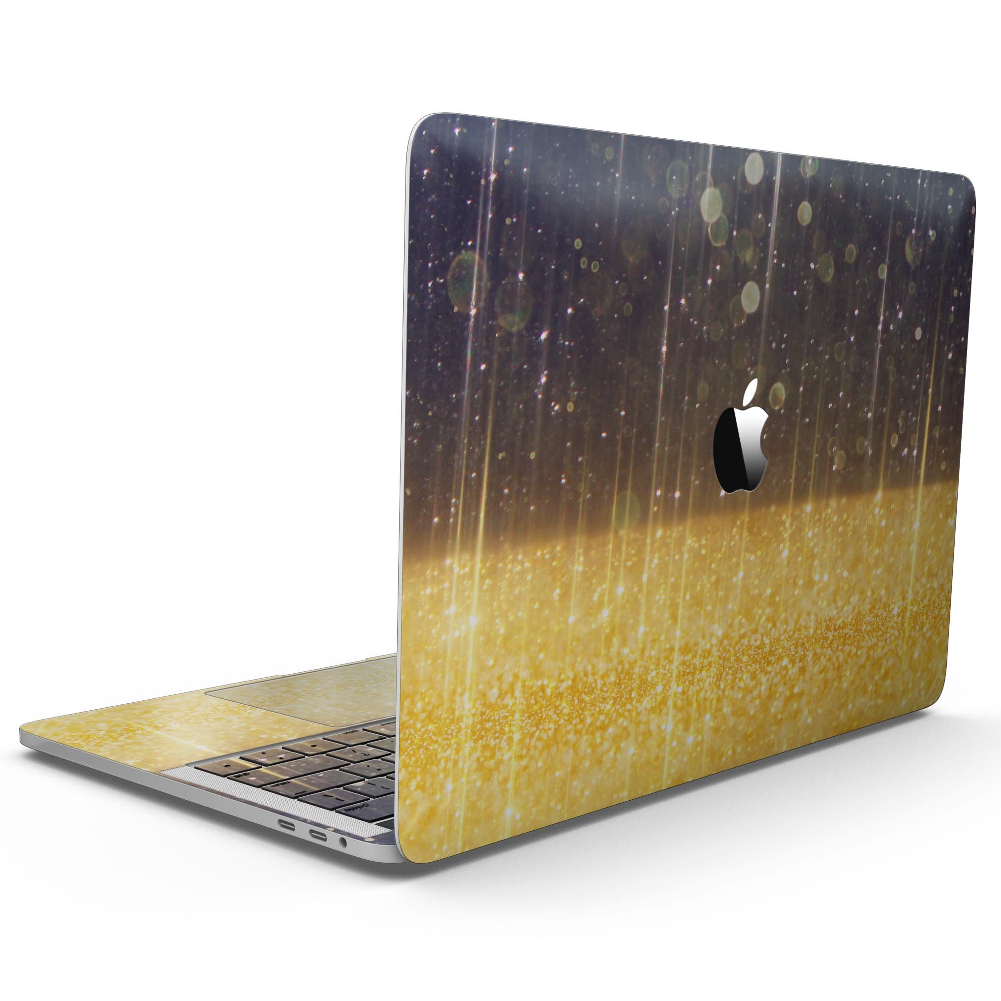 A MacBook Pro with a vibrant blue streaked skin featuring unfocused gold sparkles, showcasing its stylish design.