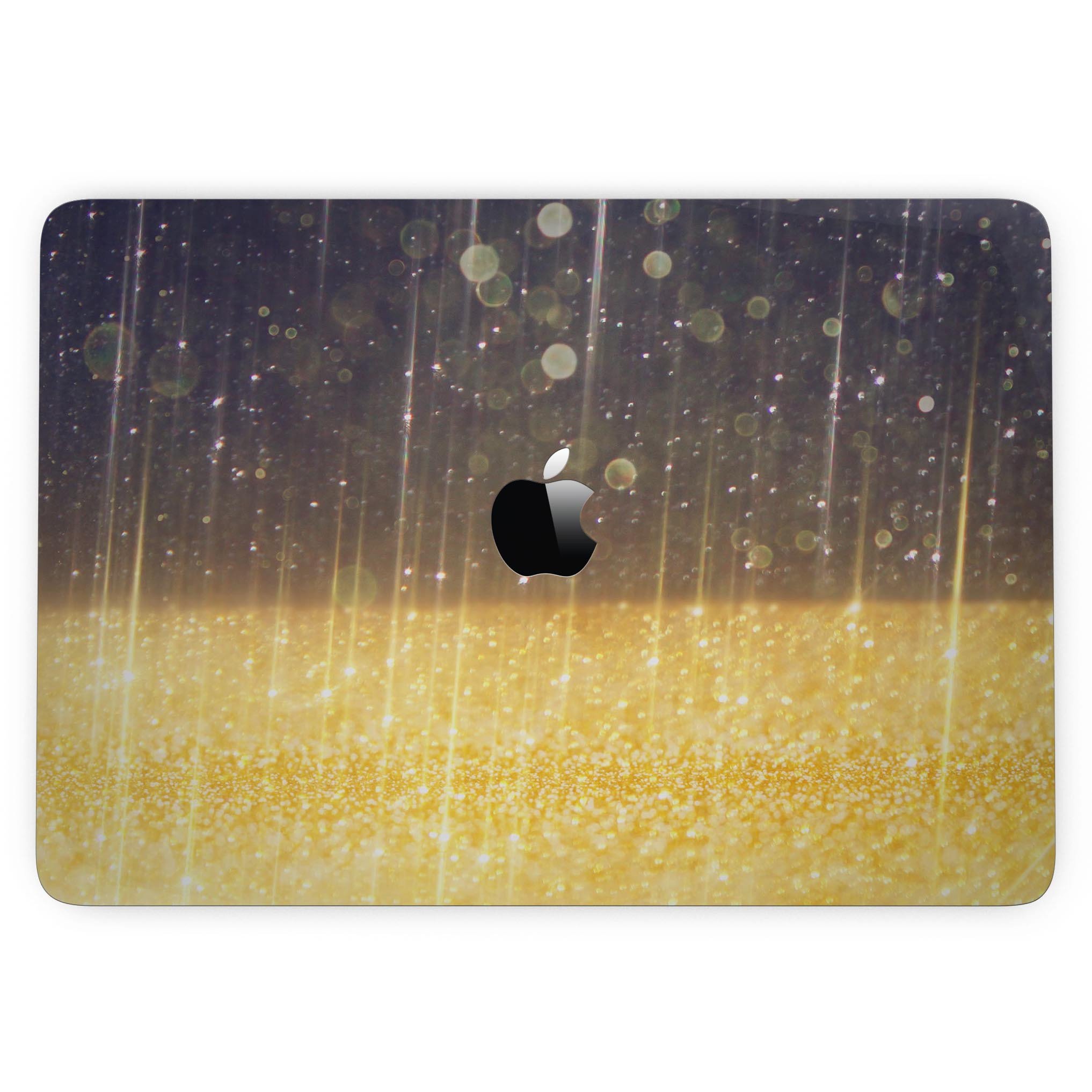 A MacBook Pro with a vibrant blue streaked skin featuring unfocused gold sparkles, showcasing its stylish design.