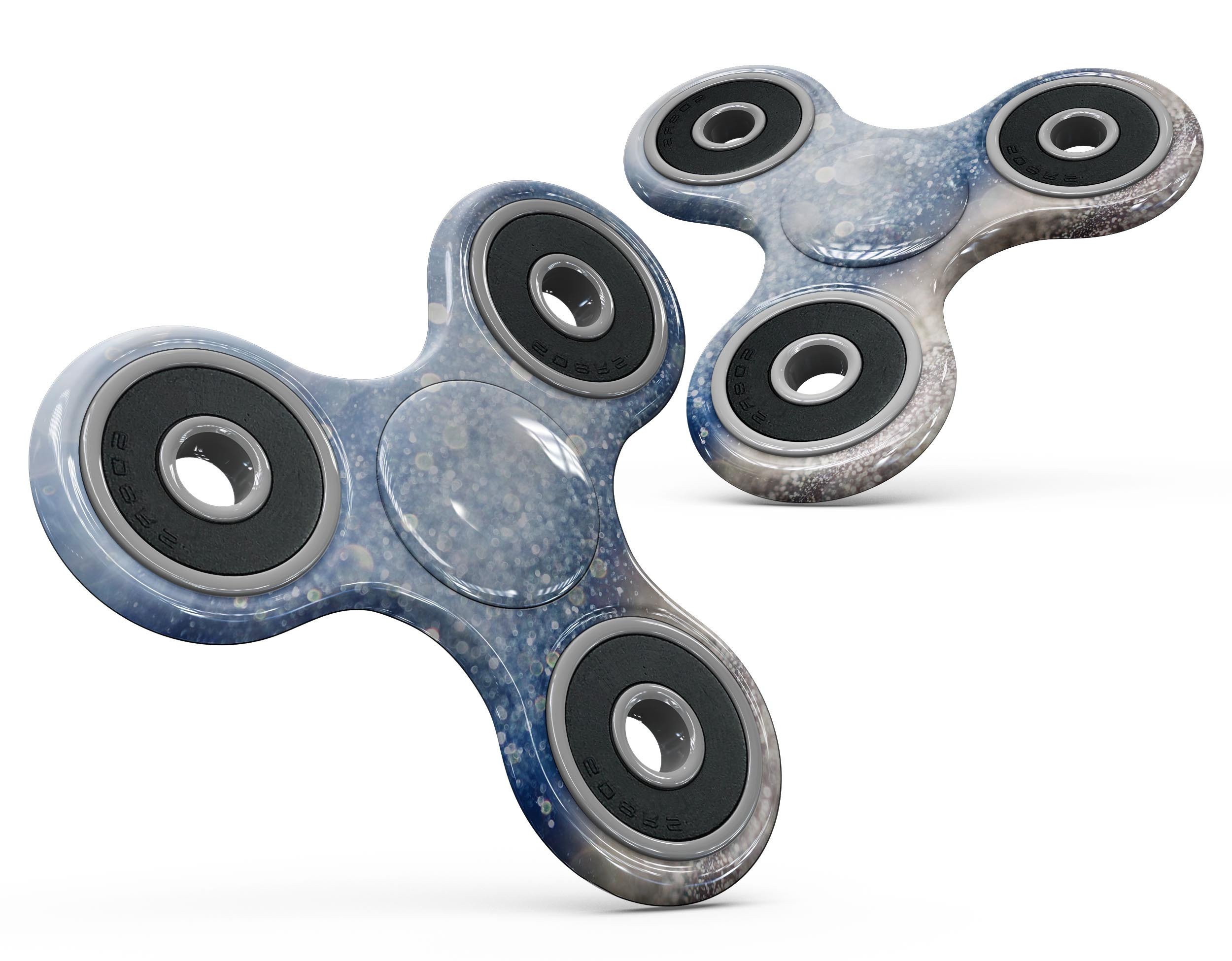 Blue Unfocused Silver Sparkle Full-Body Fidget Spinner Skin-Kit showcasing vibrant colors and a sleek design.