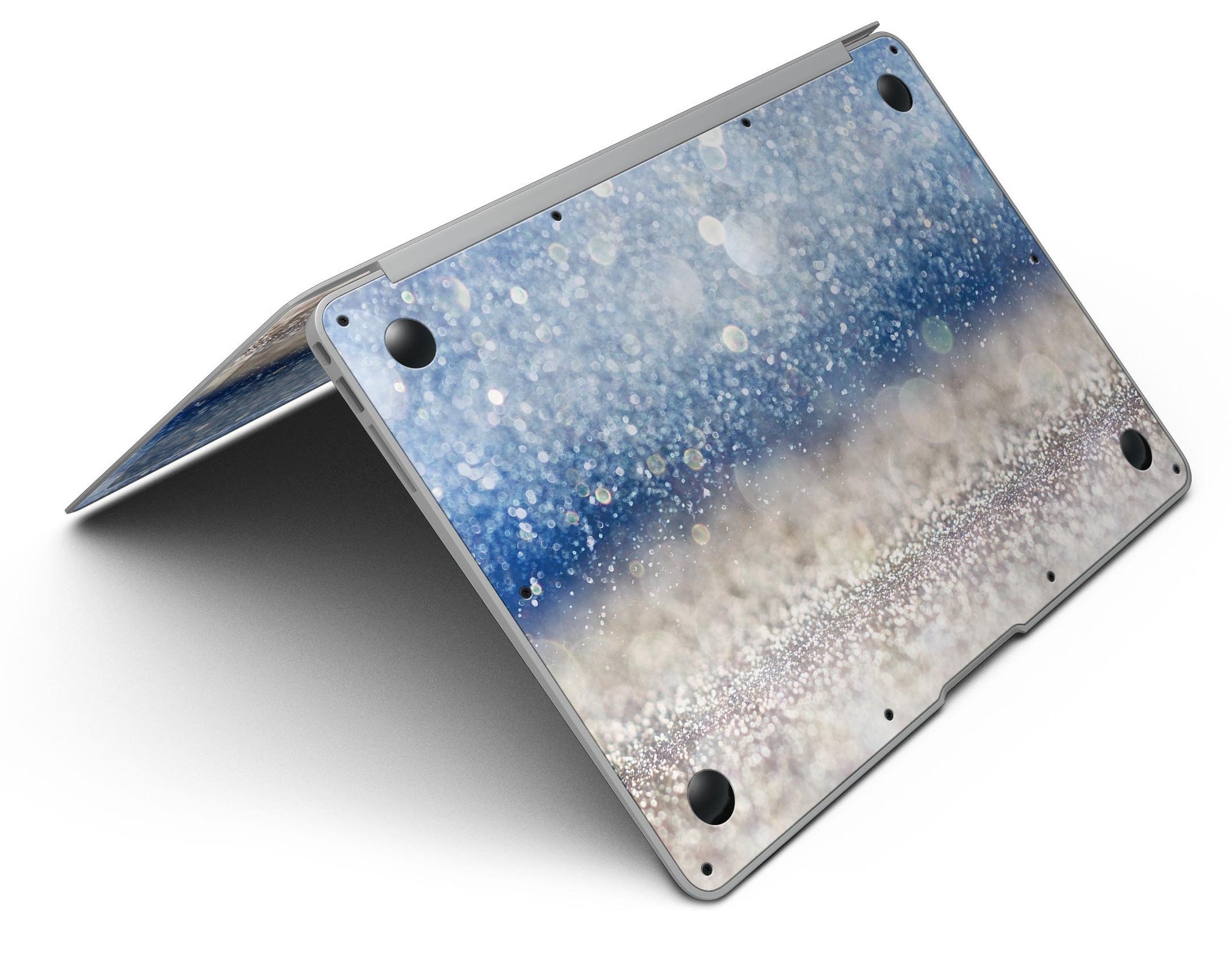 Blue Unfocused Silver Sparkle MacBook Air skin kit showcasing a vibrant design with a glossy finish.