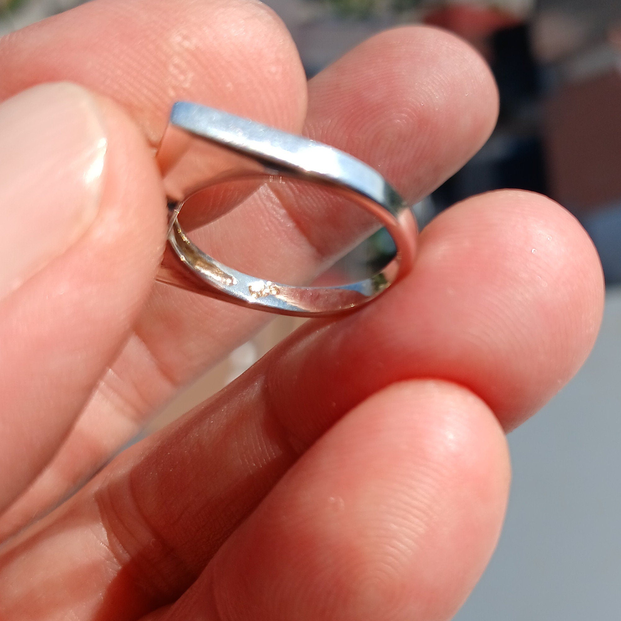 Elegant Blue Zircon Ring in polished sterling silver, featuring an oval cut gemstone.
