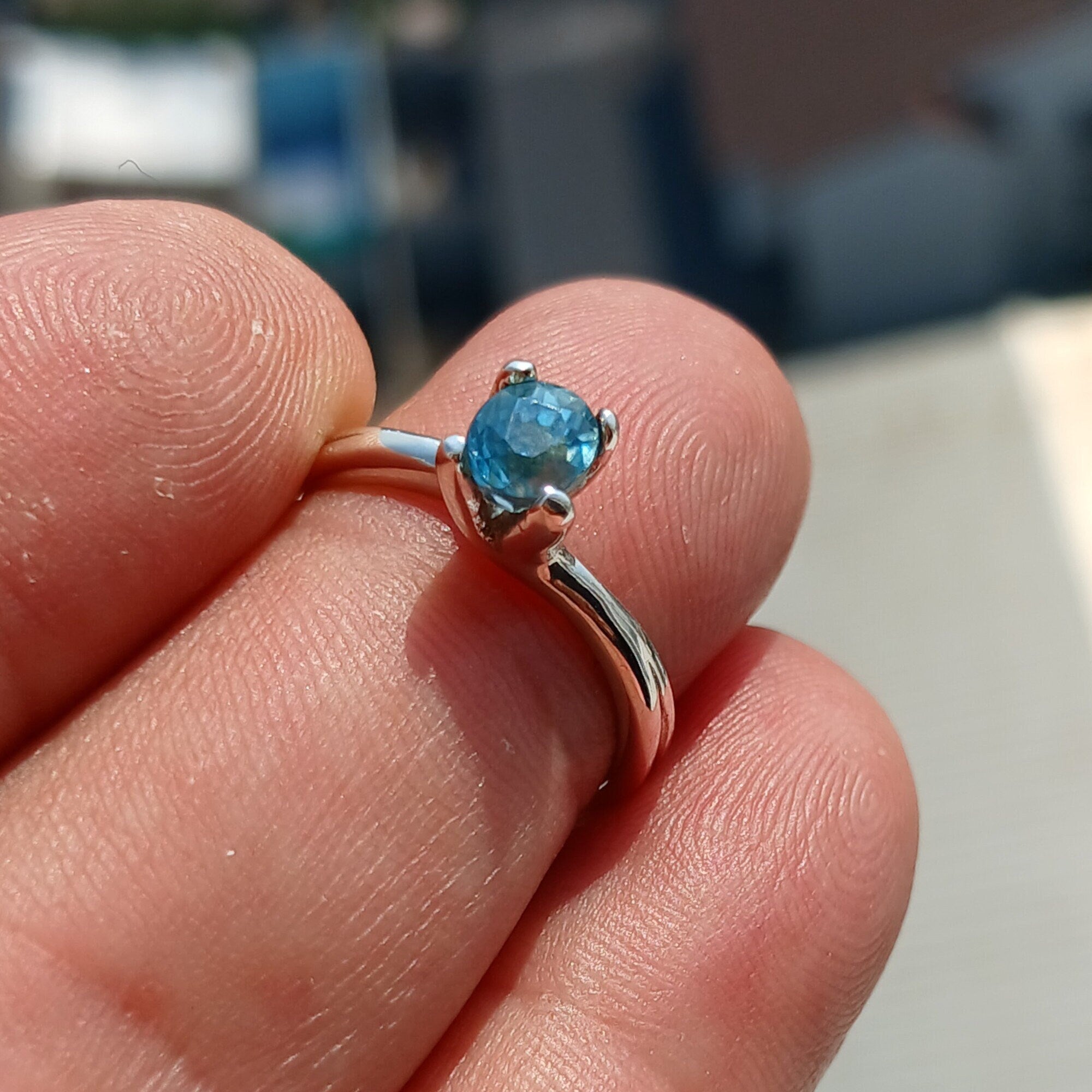 Elegant Blue Zircon Ring in sterling silver featuring an oval cut gemstone, perfect for any occasion.