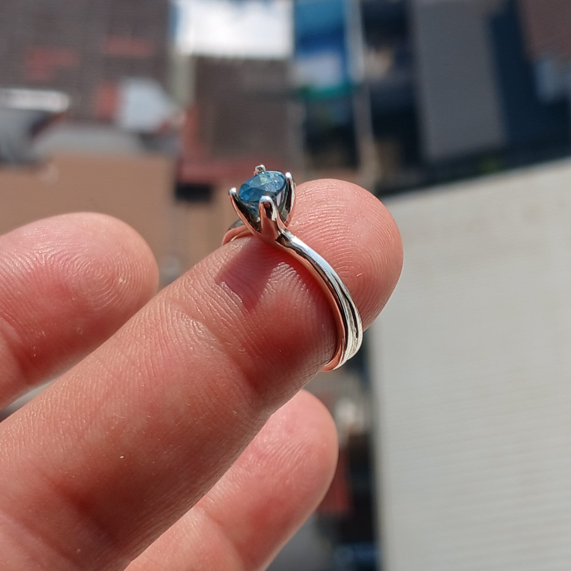 Elegant Blue Zircon Ring in sterling silver featuring an oval cut gemstone, perfect for any occasion.