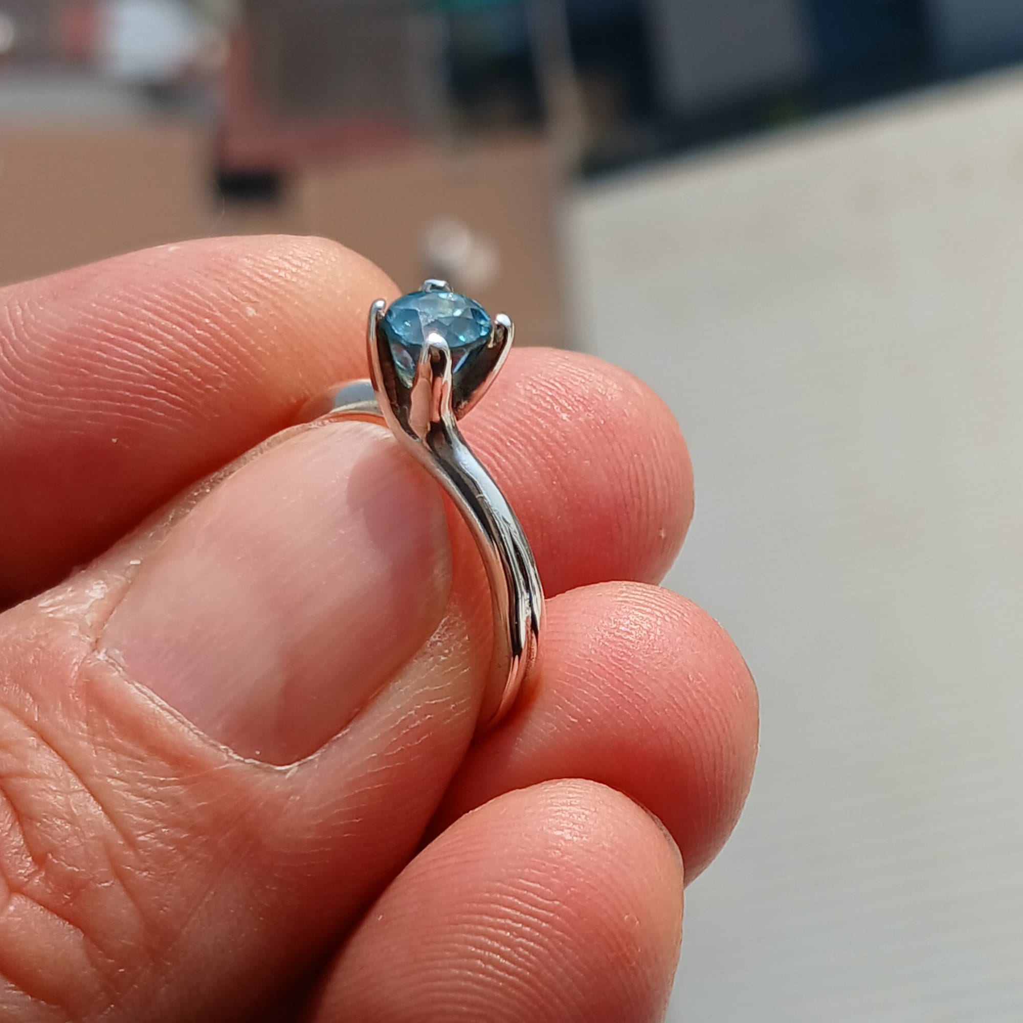 Elegant Blue Zircon Ring in sterling silver featuring an oval cut gemstone, perfect for any occasion.