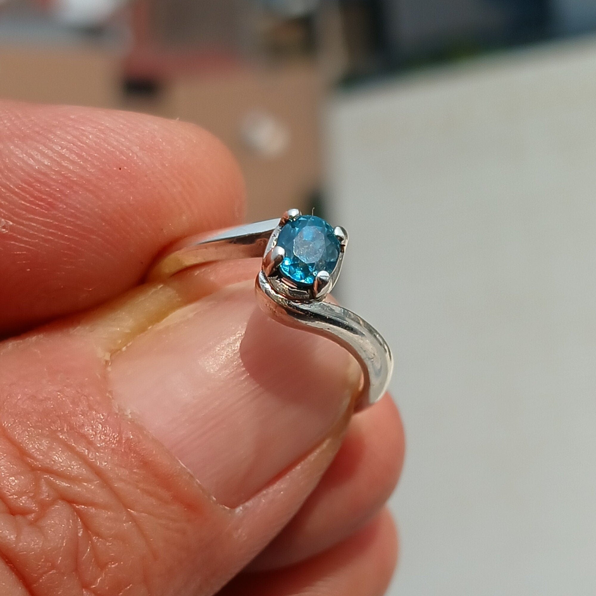 A beautiful Blue Zircon Ring set in polished 925 Sterling Silver, featuring an oval cut blue gemstone, perfect for elegant occasions.